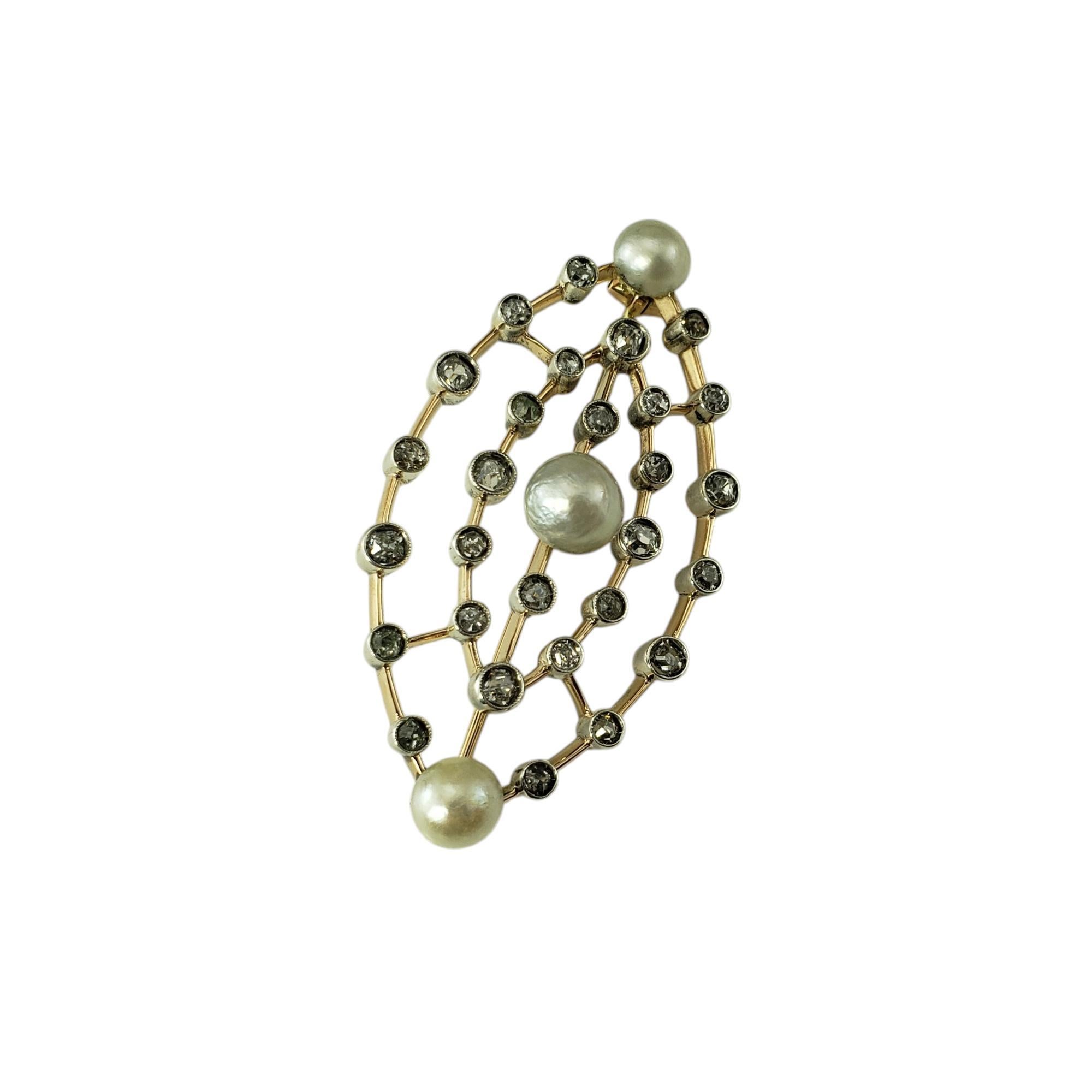 Antique 14K Yellow Gold and Sterling Silver Pearl and Diamond Brooch-

This stunning 14K yellow gold brooch features 28 old mine cut diamonds* and three round pearls (6 mm each).
*Some chips to stones not visible to naked eye. Indictive of the