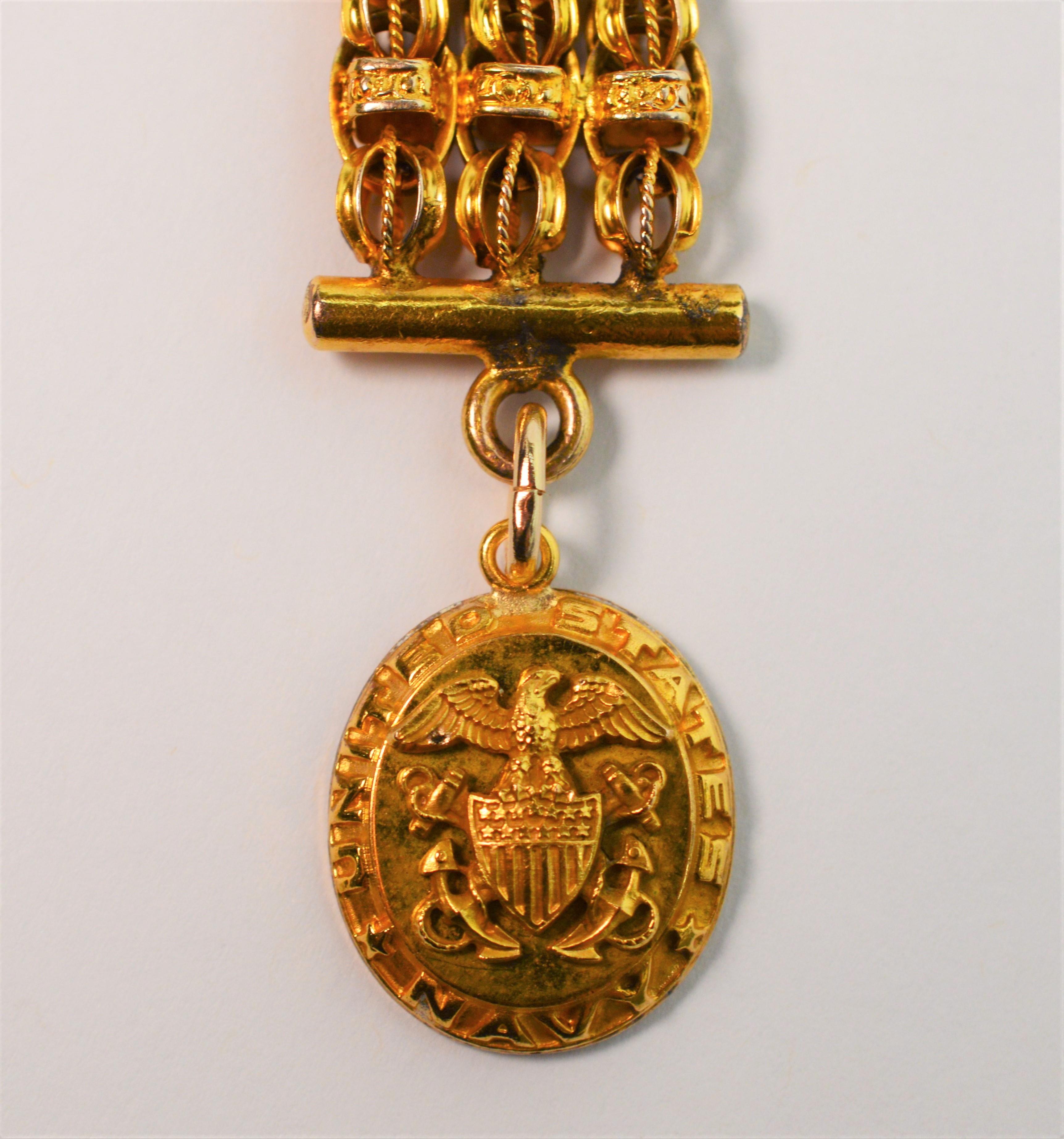 Circa 1900, for pocket watch enthusiasts. Antique fourteen karat 14K yellow gold 4.5 inch fancy pocket watch fob made with custom rolo chain links and dog clip. As an enhancement and attached at a later date is a US Naval charm in twelve karat 12K