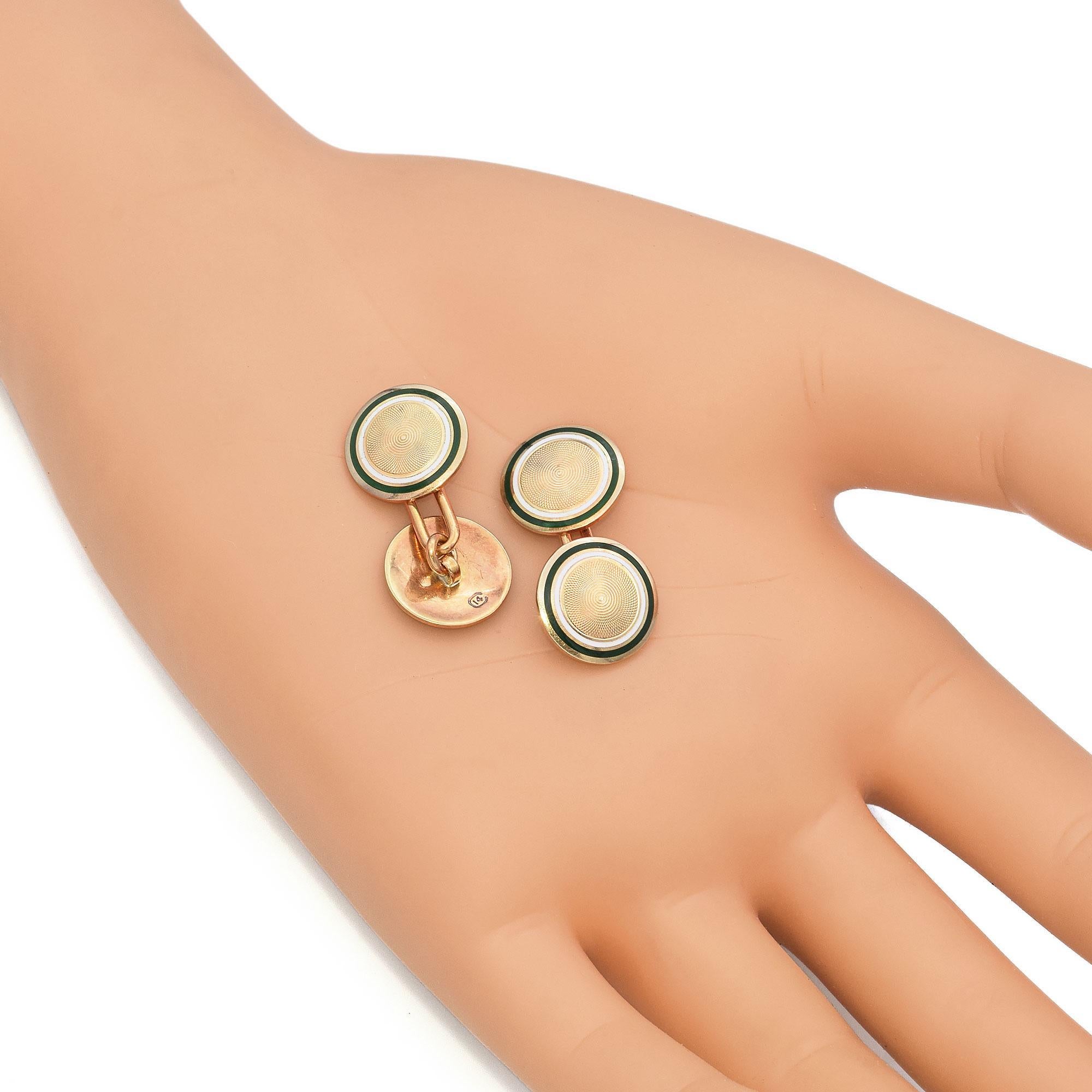 Elevate your formalwear with these exquisite antique 14K gold cufflinks, featuring a sophisticated guilloché pattern and rich green enamel detailing. The intricate concentric design at the center catches the light beautifully, while the bold enamel