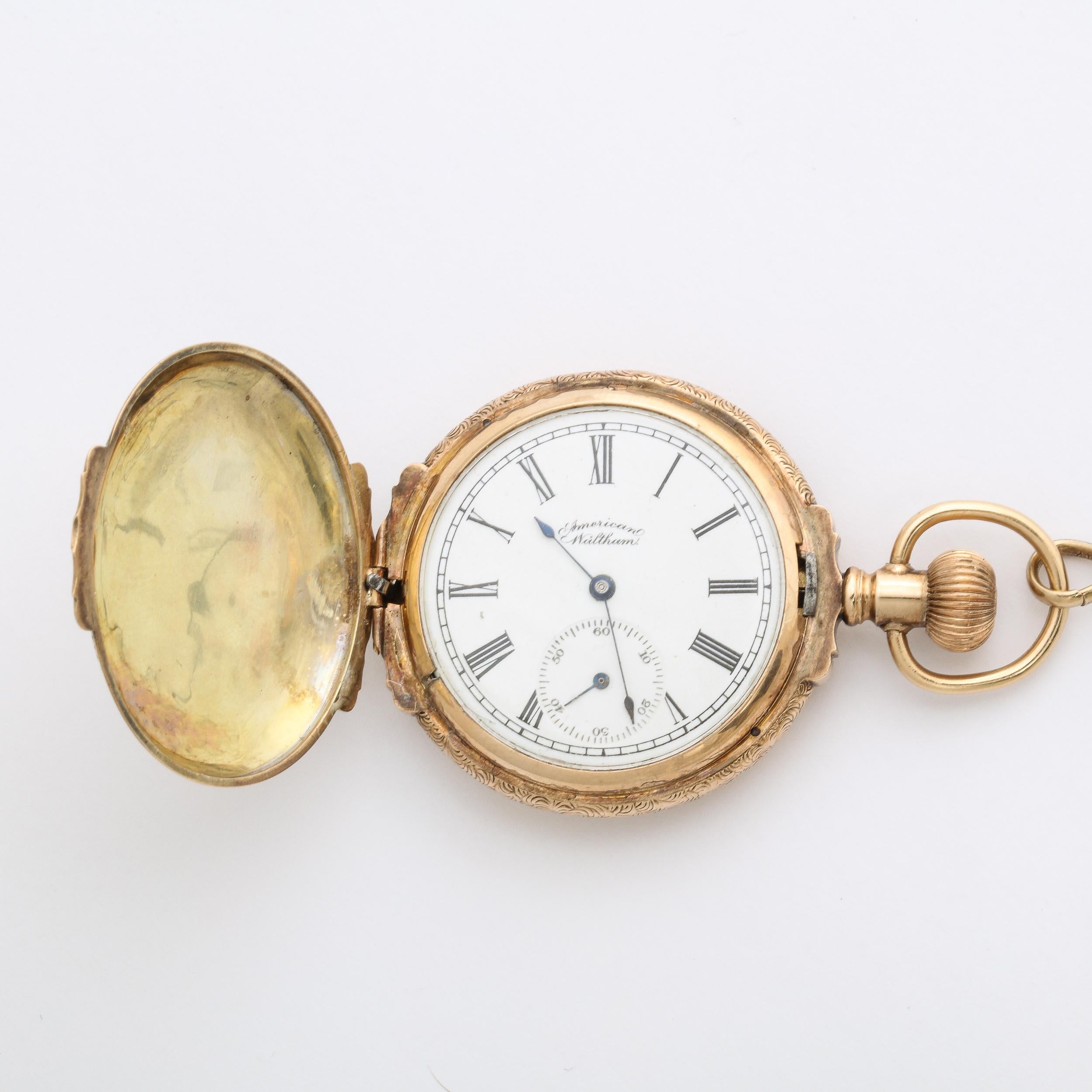 This striking antique 14K Yellow Gold Lady’s Hunting Watch w/Fob by Waltham Watch Co. 1888 retains its original gold case, movement and dial work, an exquisite addition to a collection of fine antique watches. This would be great as a necklace as
