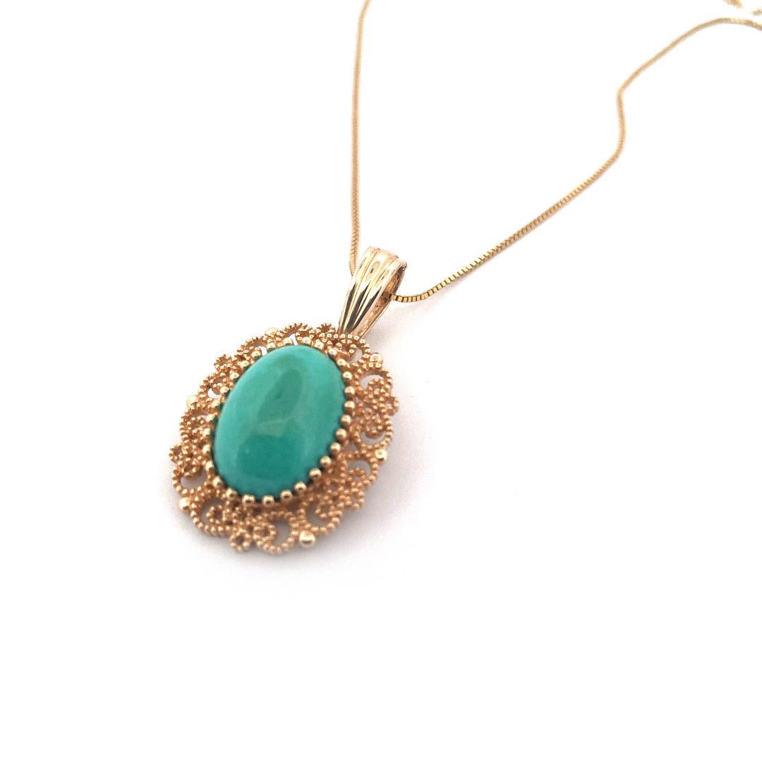 Indulge in timeless elegance with this antique 14K yellow gold necklace by Levian. This is an antique necklace made of from 14K gold and turquoise. The pendent has a beautiful Turquoise stone and the store is fitted into delicately carved gold which