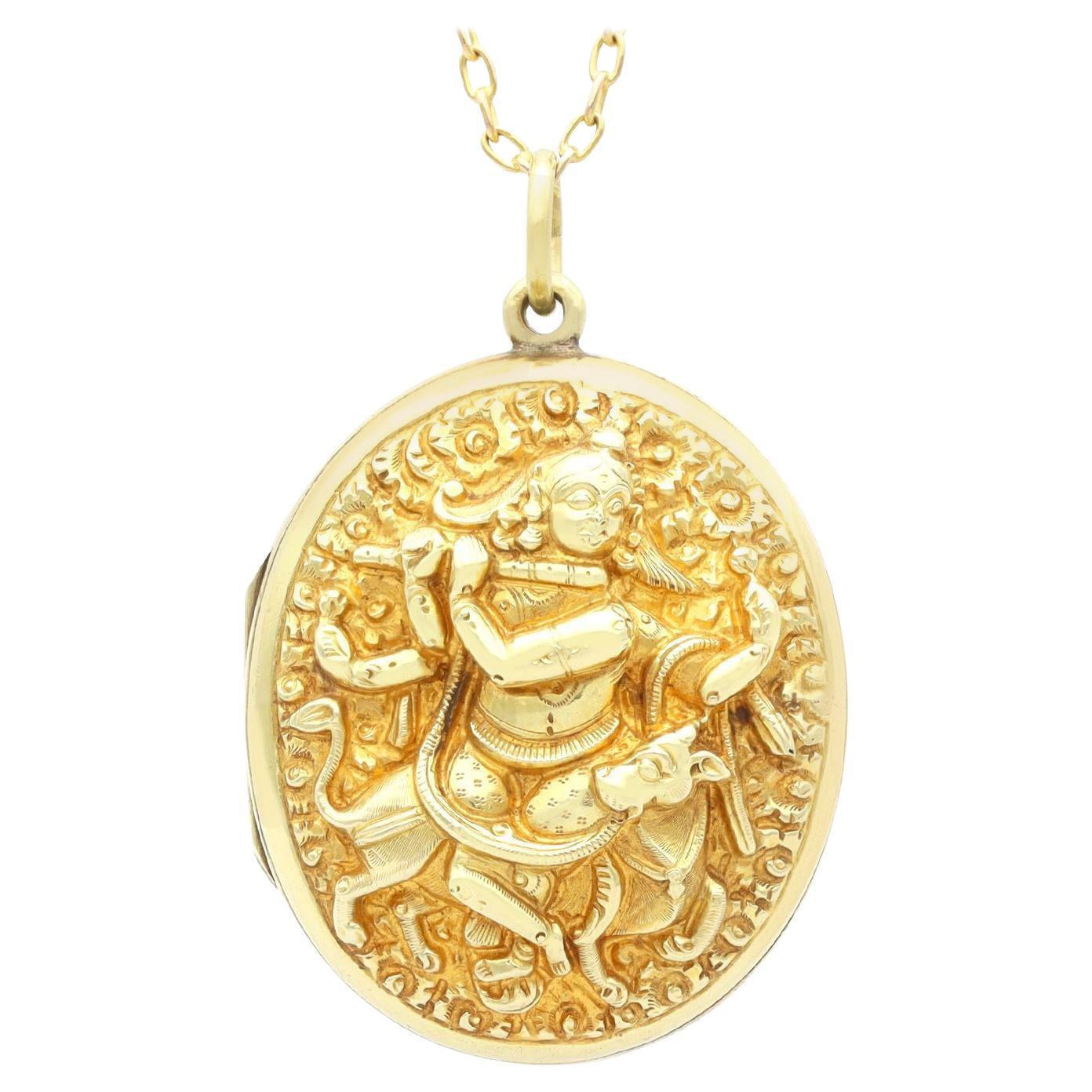 Pendentif médaillon ancien en or jaune 14 carats