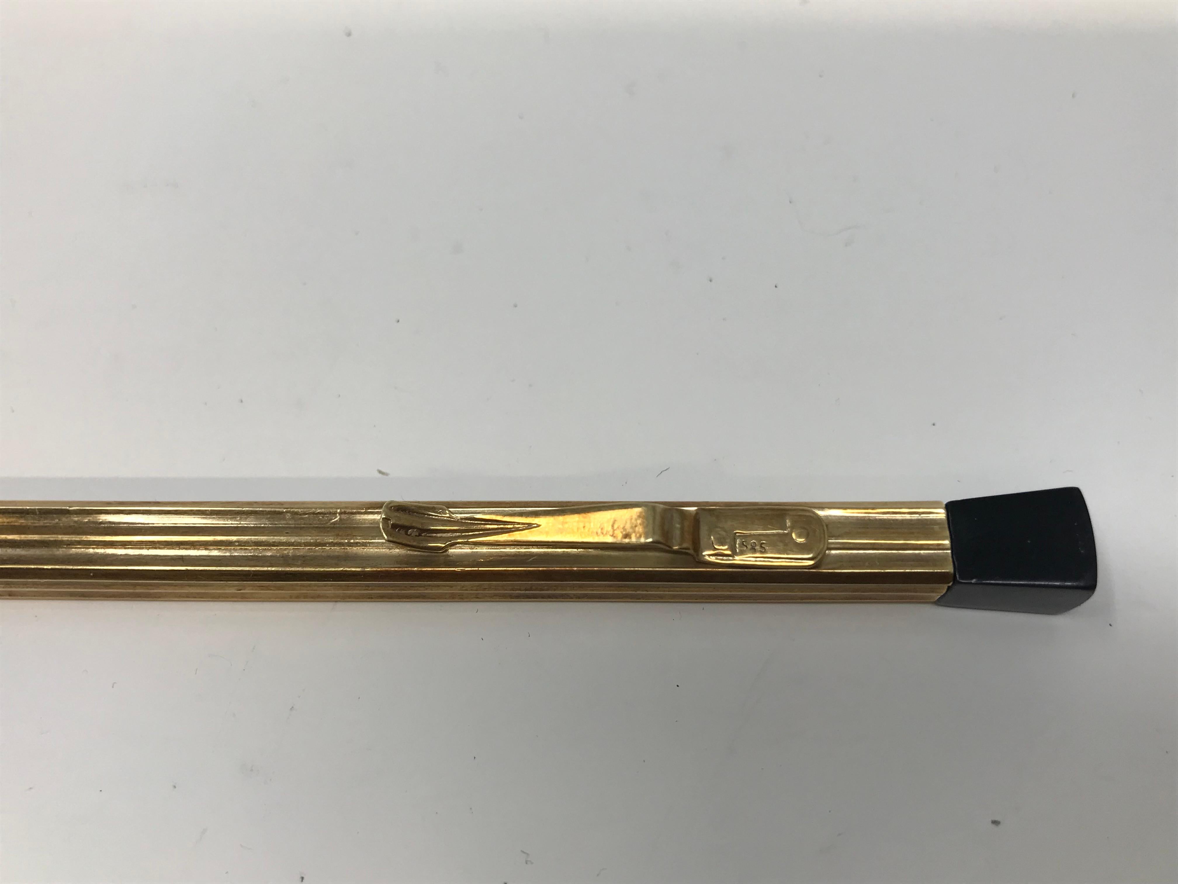Antique 14k Yellow gold propelling pencil pen, and steel, stamped 585. Measures 10.7cm long, in good condition.