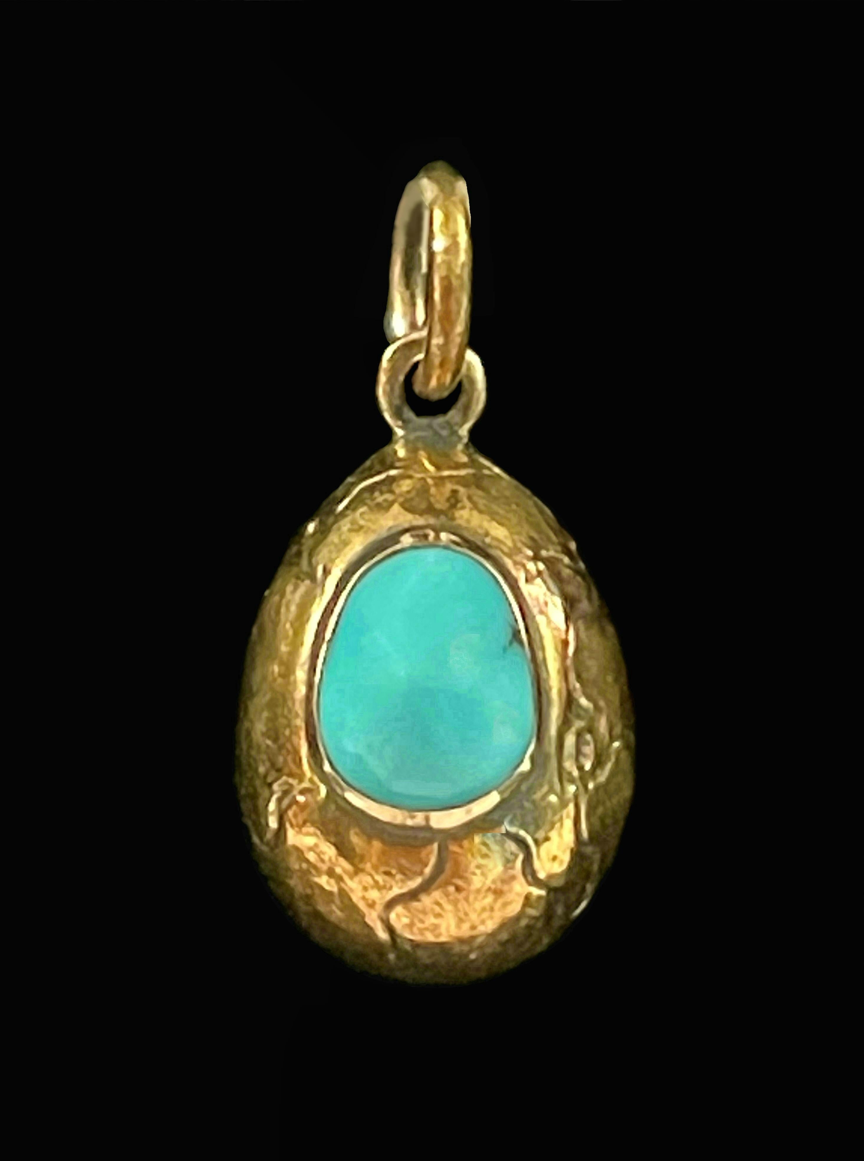 Fine antique 14K yellow gold and Persian Turquoise Easter egg charm or pendant - featuring a bezel set cabochon cut Persian Turquoise (approx. 1.57 Total Carat Weight - 6.5 mm. Wide x 8 mm. Long x 4 mm. Deep) - the gold body of the egg delicately