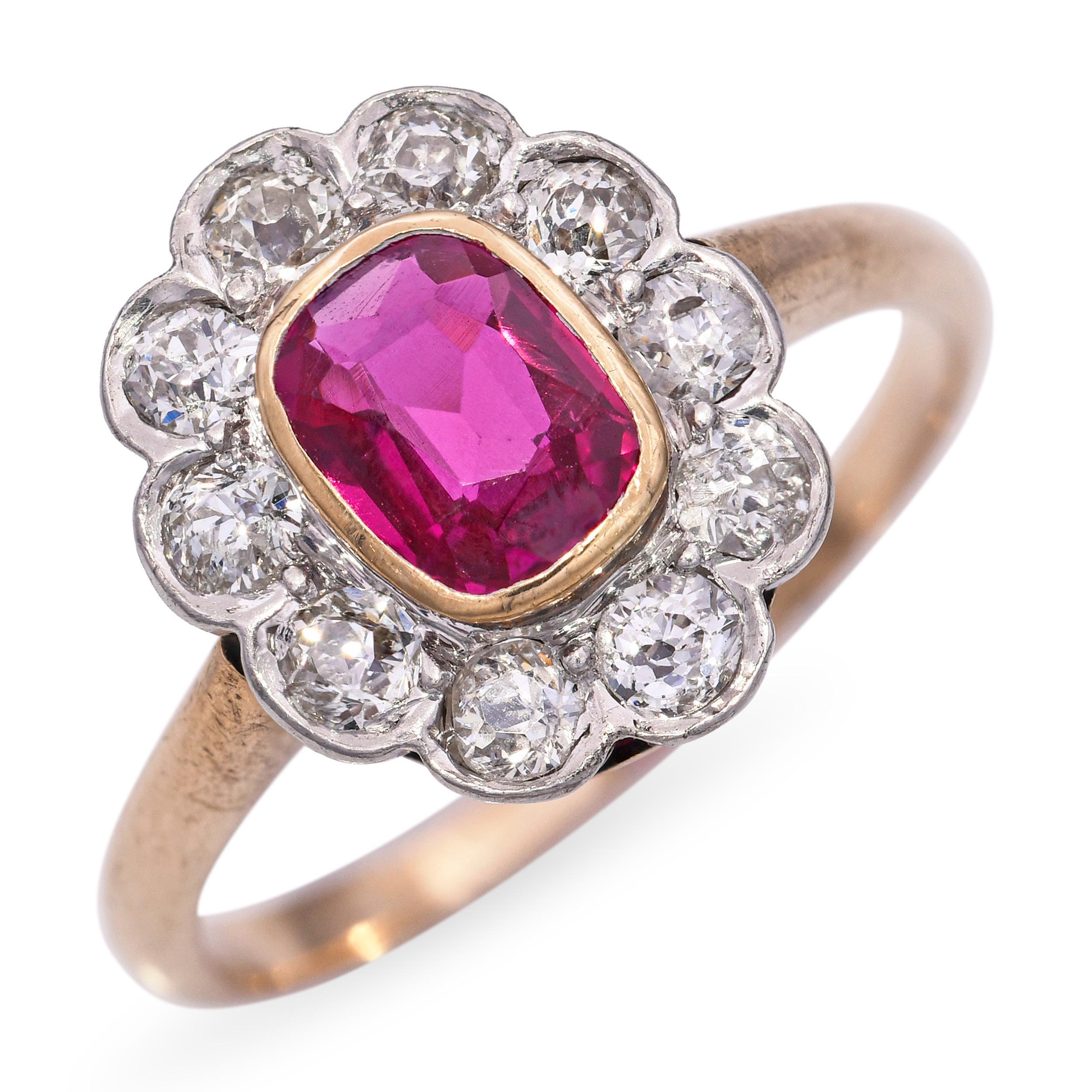 This vintage ring is crafted in 14k yellow gold and showcases a vibrant 0.51ct ruby at its center. Surrounding the ruby is a delicate halo of sparkling diamonds, enhancing the rich red hue with added brilliance. The warm gold setting provides a