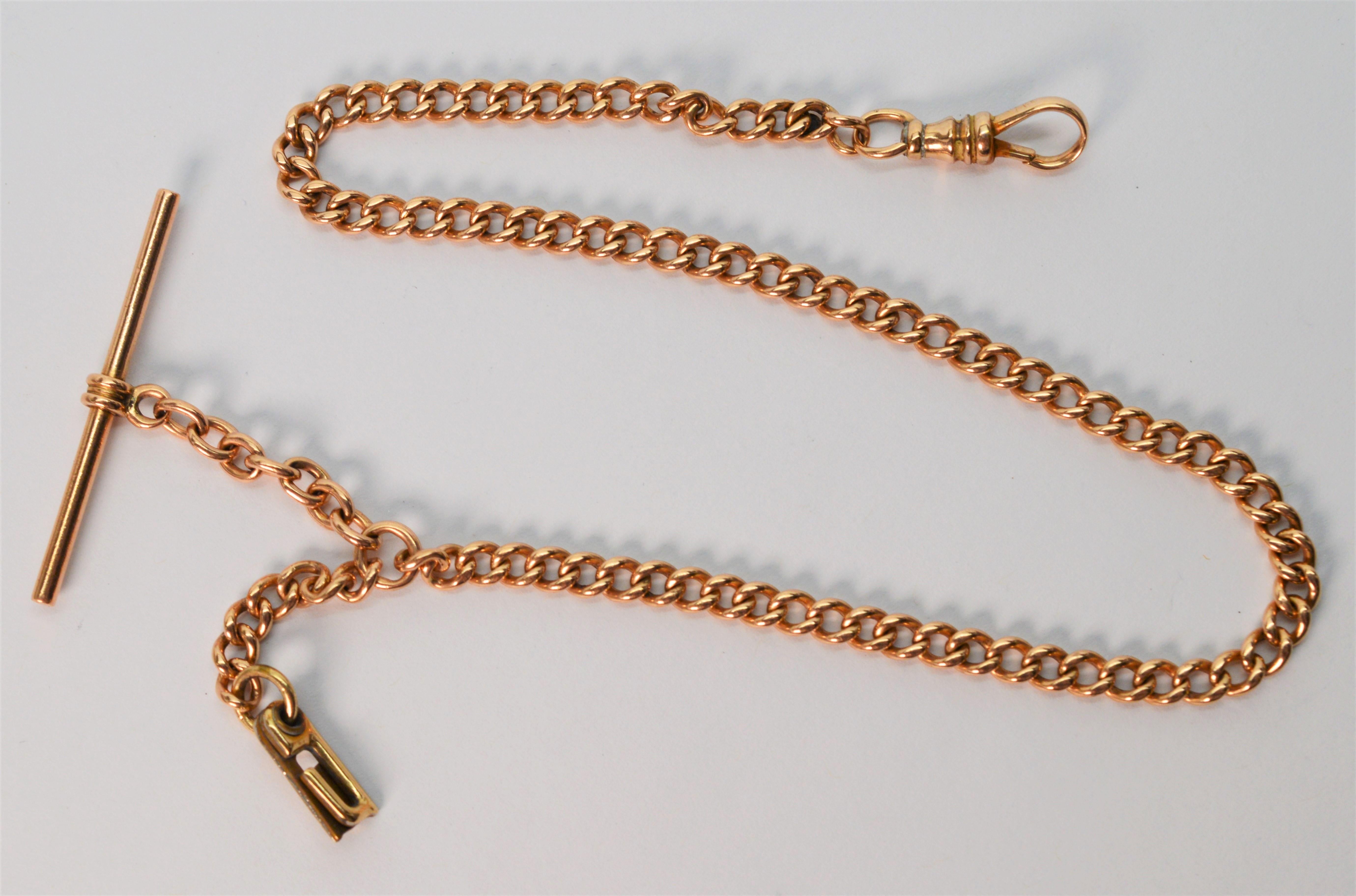 Perfect accessory for pocket watch enthusiasts, this twelve inch antique pocket watch chain made of 14K yellow gold has the perfect set up with a T bar for attachment to apparel, dog clip for attachment to a favorite pocket watch and hard to find