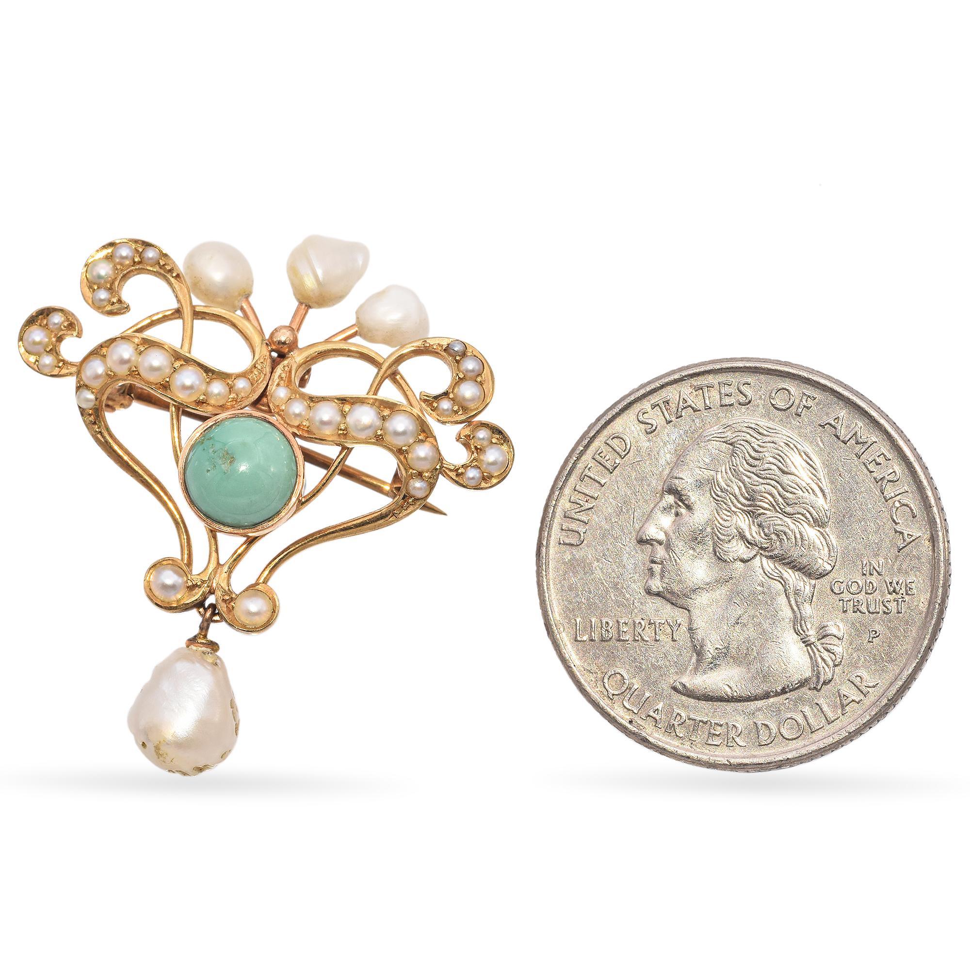 An exquisite brooch featuring a central turquoise cabochon, surrounded by intricate gold scrollwork adorned with lustrous seed pearls. Five baroque pearls accentuate the top, while a single baroque pearl dangles elegantly below.

Weight: 4.4 grams