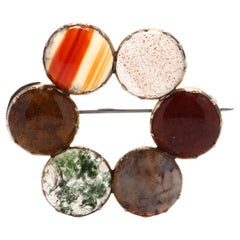 Antique 14K Yellow Gold
Sterling Silver Agate Circle Brooch Antique 14K Yellow Gold
Sterling Silver Agate Circle Brooch