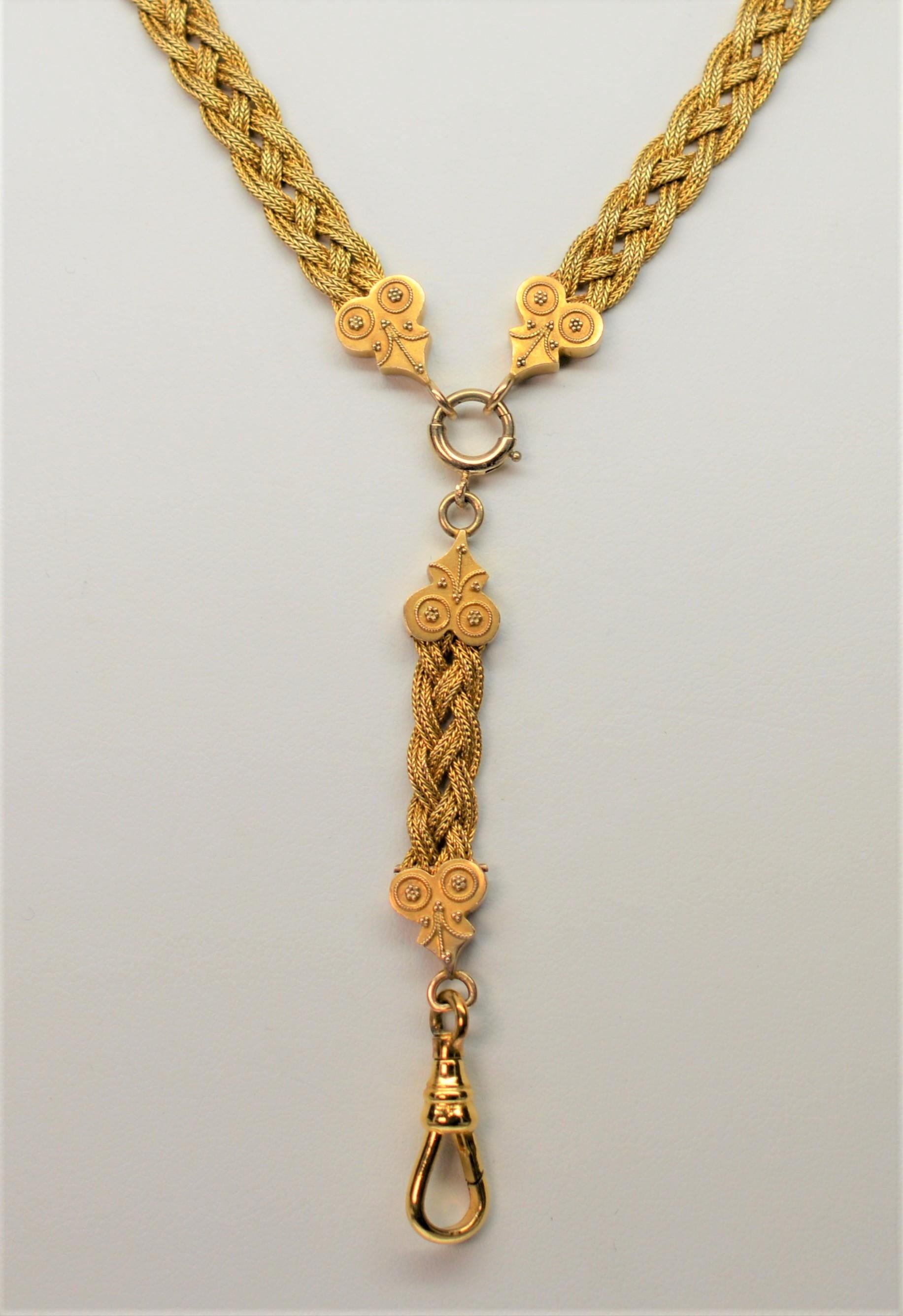 A curious piece. Your watch, charm or pendant can be suspended from this interesting woven Antique Necklace made of 14K Yellow Gold. The matching, descending  and detachable drop-lead contains a clasp, also in 14K Yellow Gold, which may have been