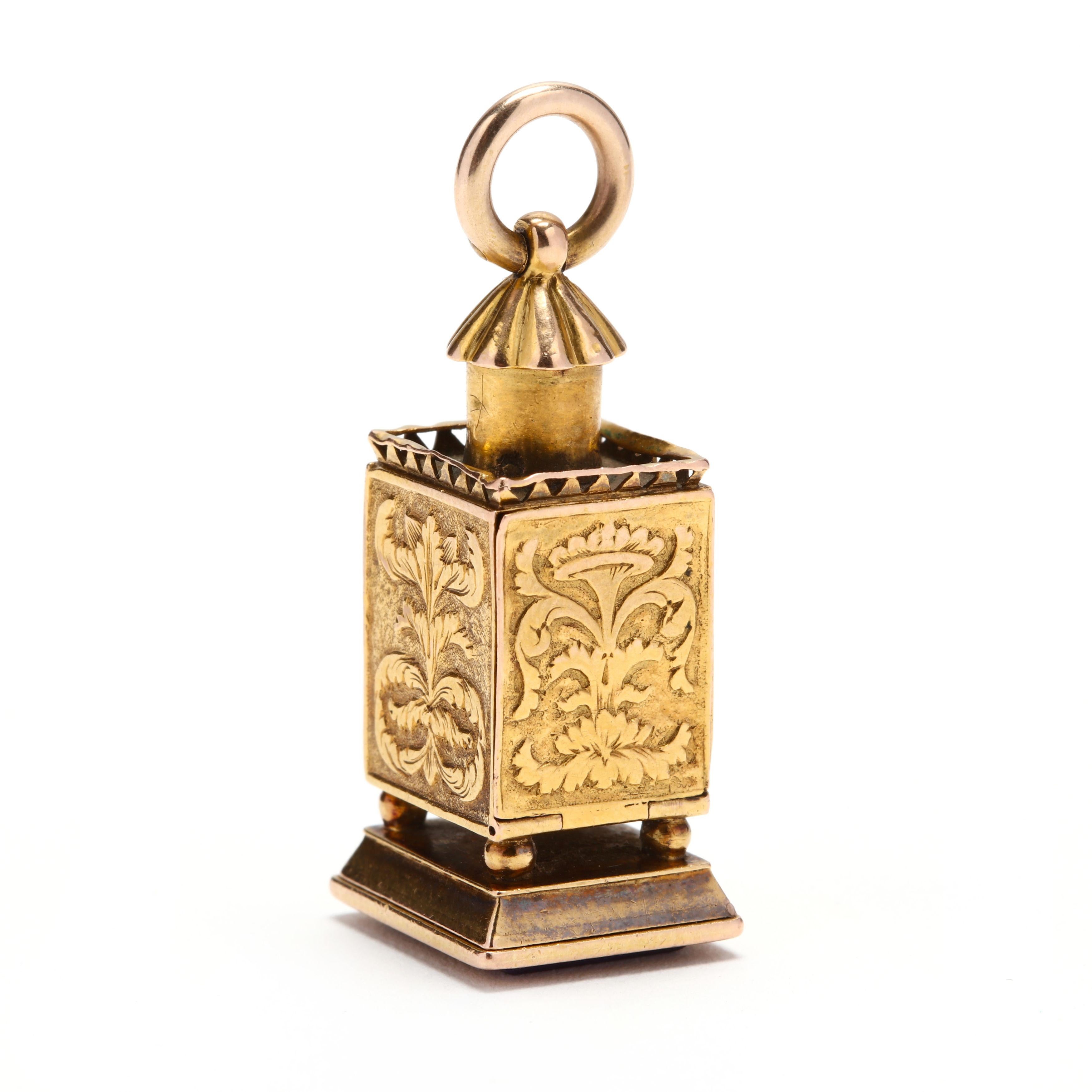 An antique 14 karat yellow gold lapis lantern charm. This charm features a rectangular lantern design with an engraved feather motif and a lapis bottom that is carved Evelyn.

Length: 1 7/16 in.

Width: 9/16 in.

Weight: 6.10 dwts.

Ring Sizings &