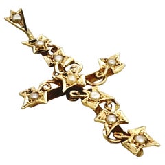 Antique 15 carat yellow gold cross in ivy leaf design with seed pearls