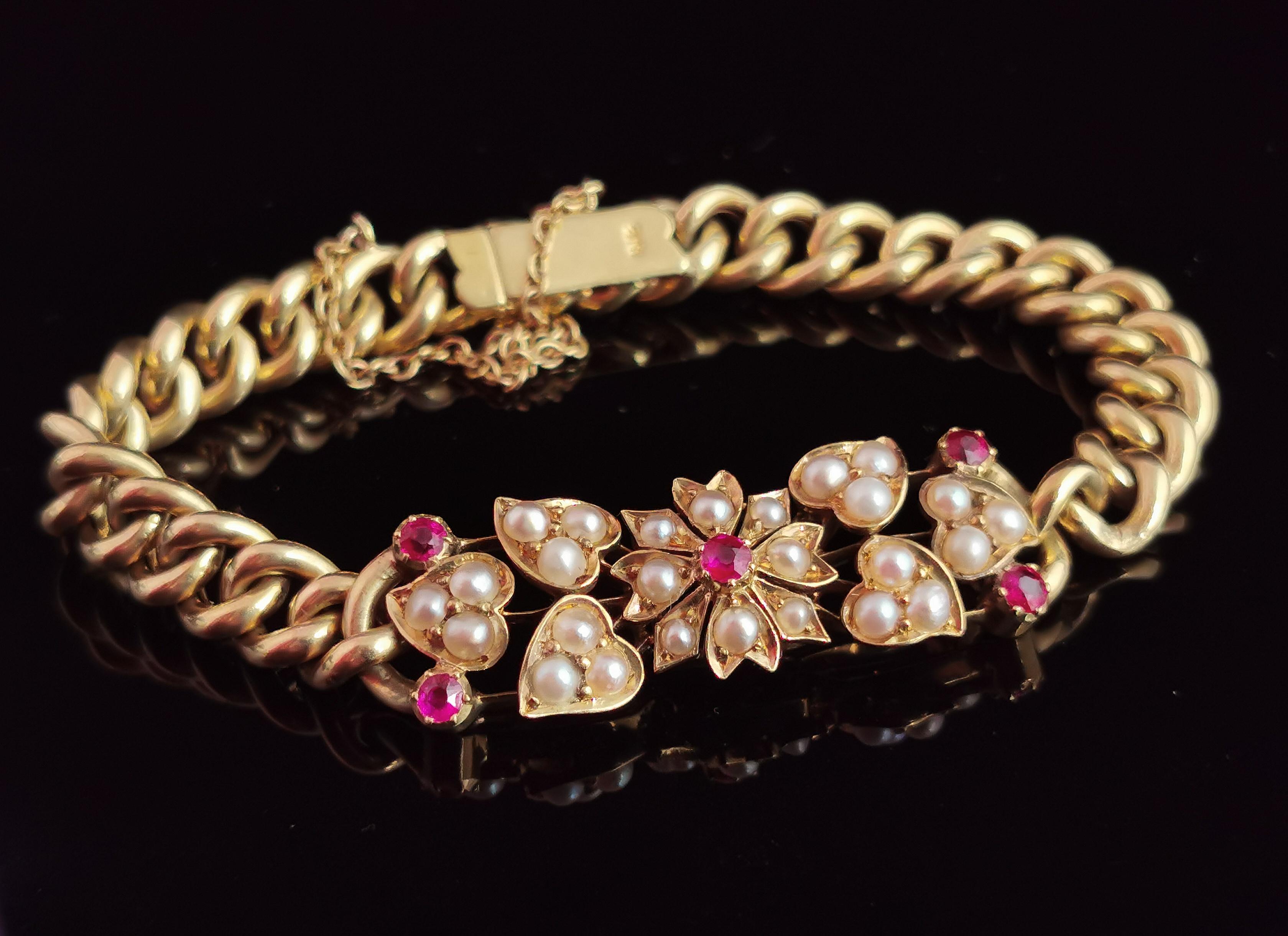 A rare antique 15 karat gold floral curb bracelet set with rubies and seed pearl.

This fine bracelet is certainly a very high quality piece, it has an unusual floral design panel to the front situated between the rich 15 karat yellow gold