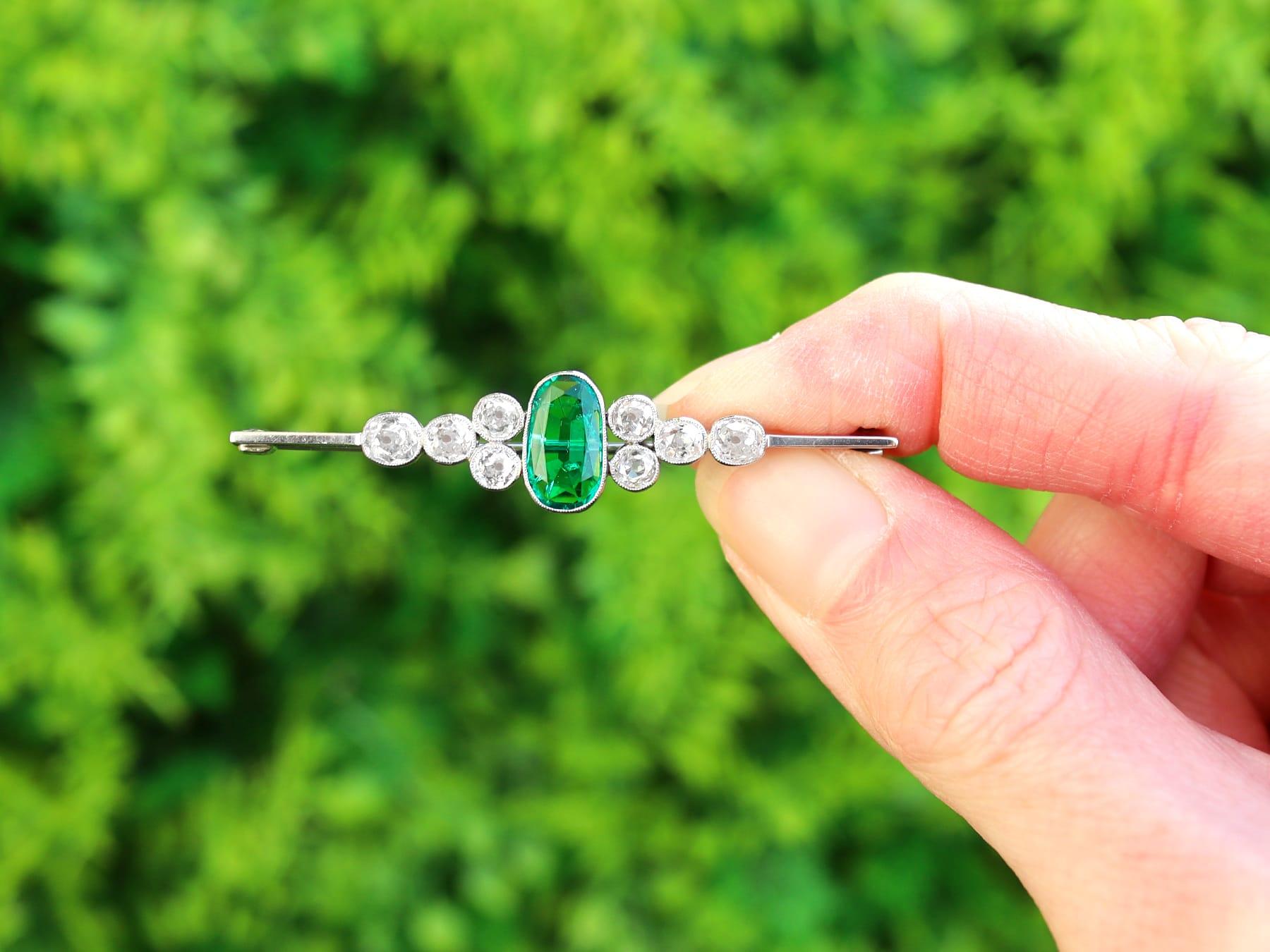 A stunning, fine and impressive 1.50 carat emerald and 2.62 carat diamond, 18 karat white gold and platinum set bar brooch; part of our diverse antique jewellery collections.

This stunning, fine and impressive Edwardian brooch has been crafted in