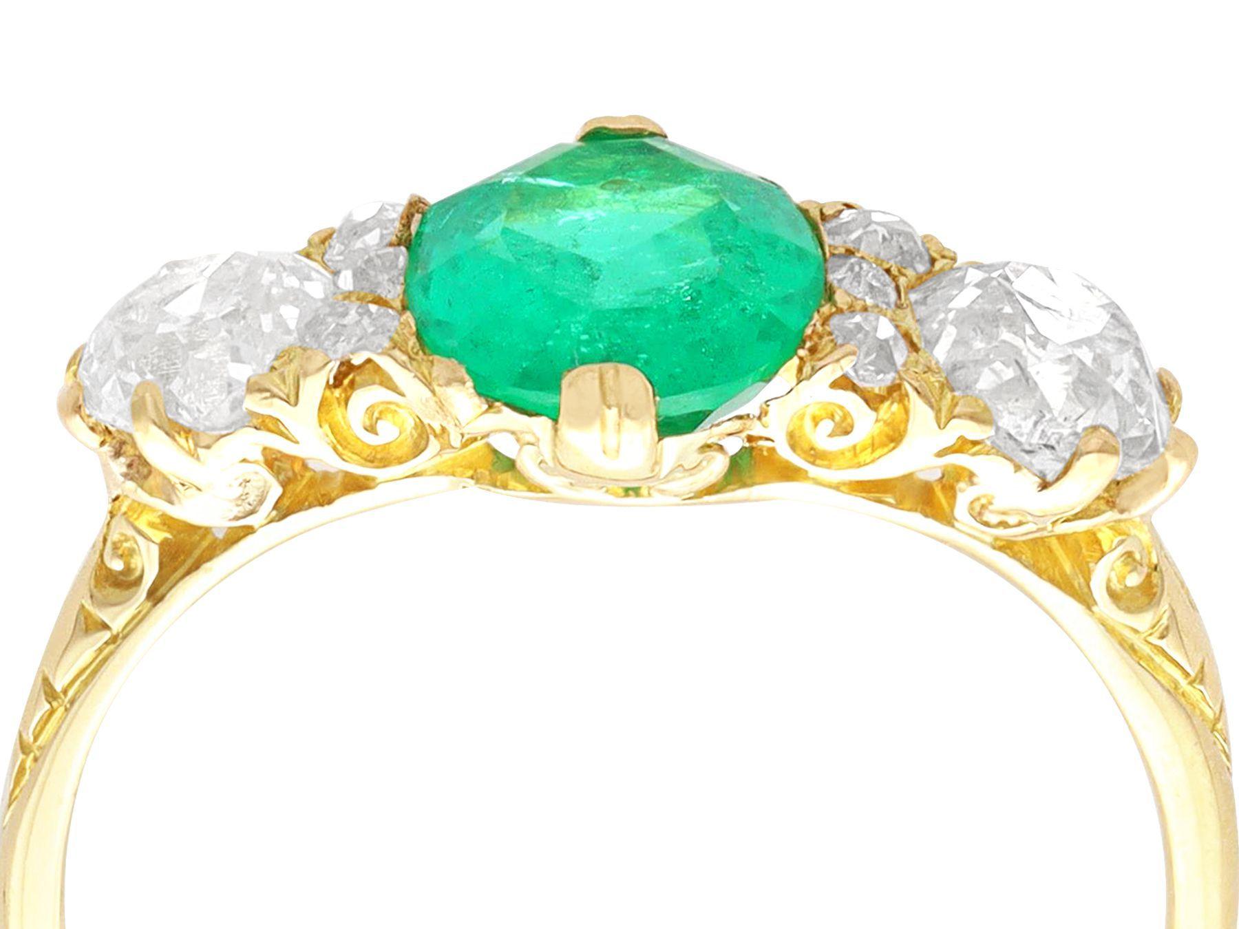 Oval Cut Antique 1.50 Carat Emerald and 2.64 Carat Diamond Yellow Gold Ring For Sale