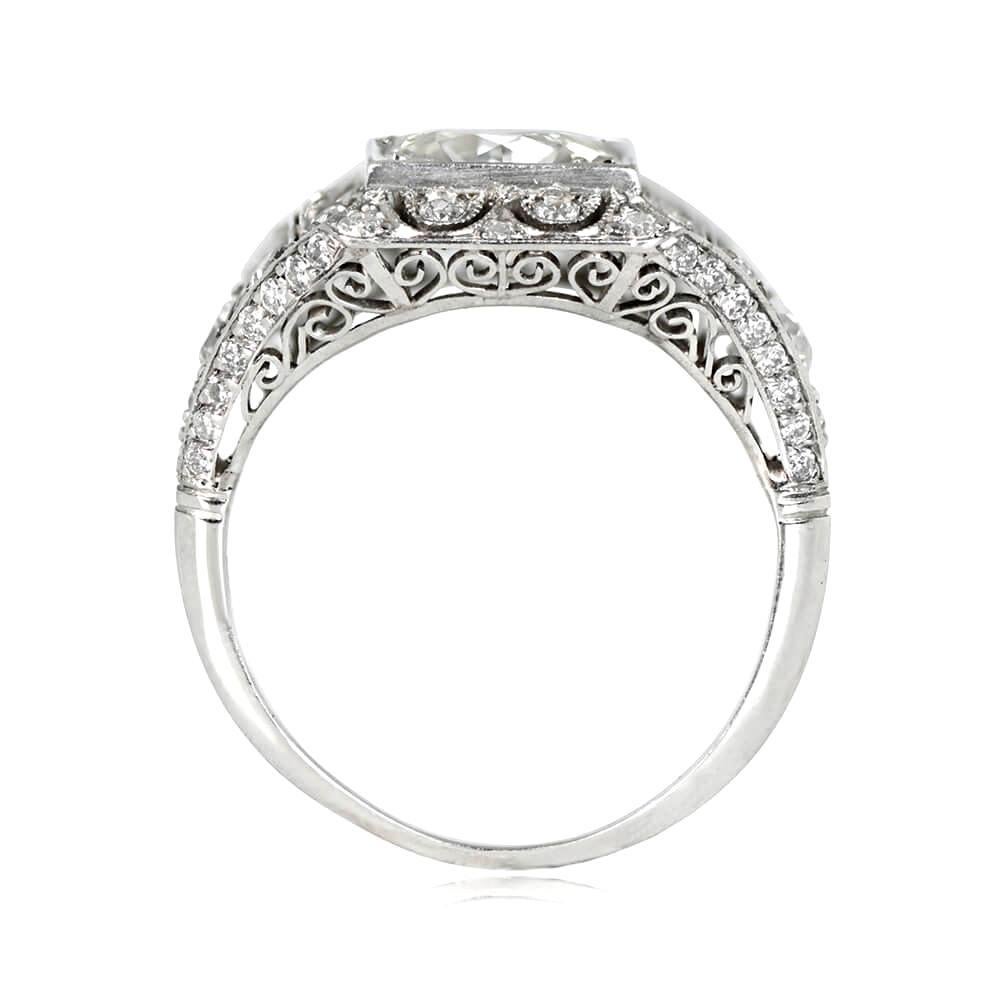 Antique Edwardian engagement ring showcases a 1.53 carat old European cut diamond (J color, VS1 clarity) set in a square bezel with prongs. The platinum band features a floral openwork design adorned with old European cut diamonds, and triangular