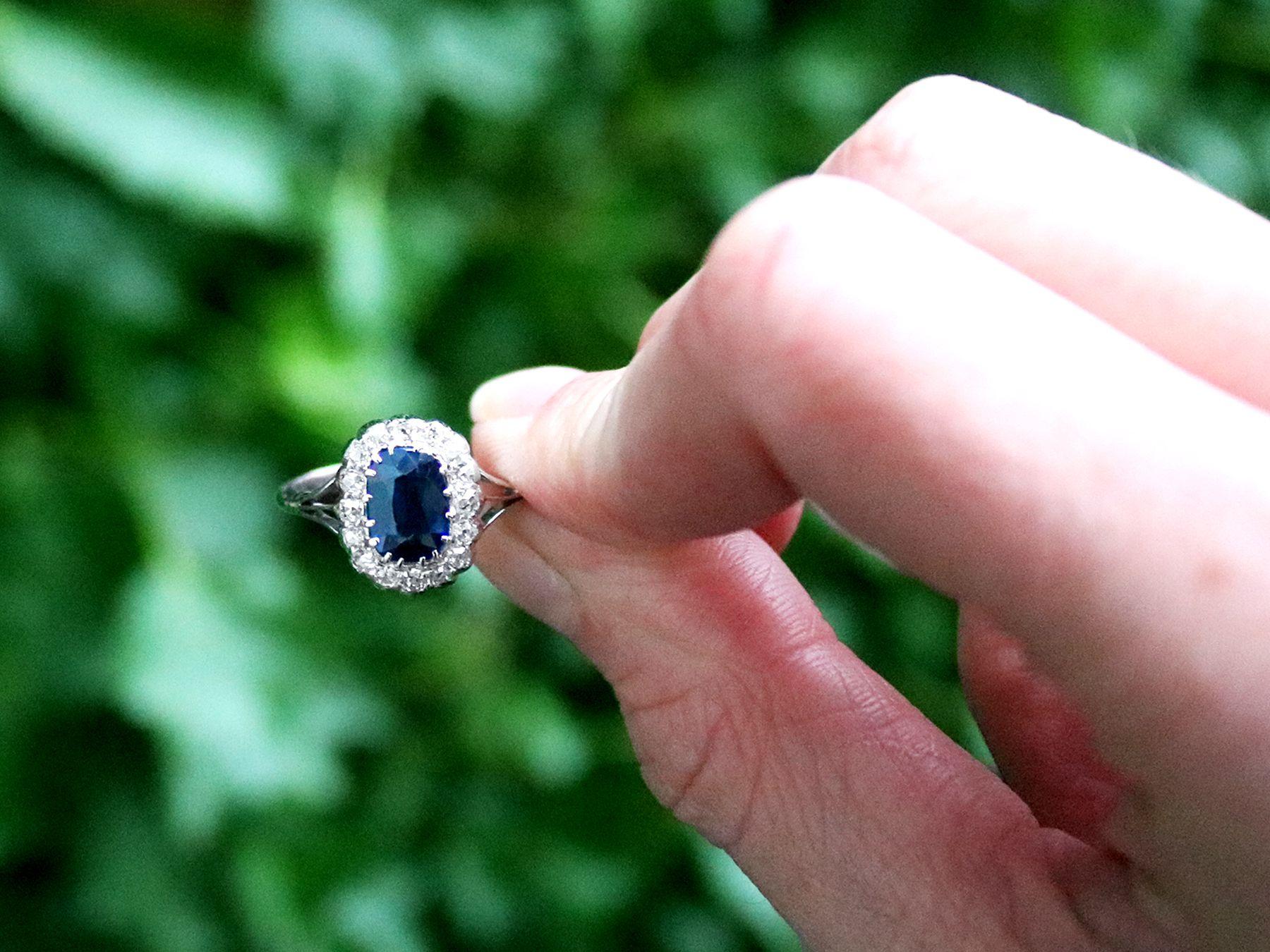 A fine and impressive antique 1.55 carat sapphire and 0.36 carat diamond, 18 karat white gold cluster style dress ring; part of our diverse antique jewelry and estate jewelry collections

This fine and impressive blue sapphire and diamond ring has