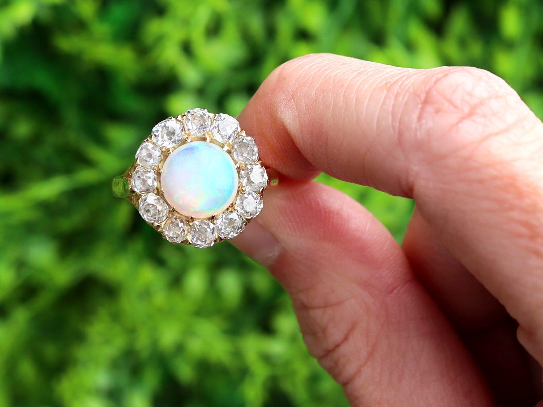 A stunning, fine and impressive antique 1.56 carat opal and 2.10 carat diamond, yellow gold dress ring; part of our diverse range of antique opal engagement rings and estate jewelry collections

This stunning, fine and impressive antique gold opal