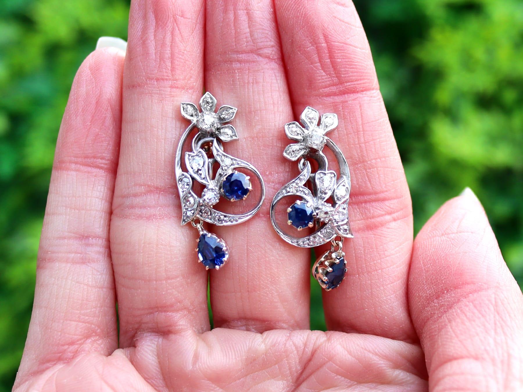A fine and impressive pair of 1.56 carat sapphire and 1.20 carat diamond, 9 karat yellow gold and silver set earrings; part of our diverse antique floral jewellery collections.

These fine and impressive antique sapphire earrings have been crafted