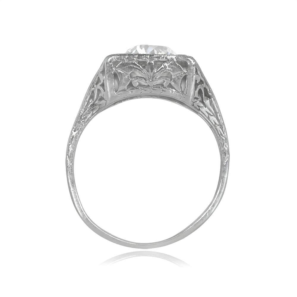 Immerse yourself in the elegance of this platinum Art Deco ring, a true masterpiece from the antique era. Commanding attention at its center is a captivating 1.59-carat old European cut diamond, skillfully pave-set within a square bezel. The