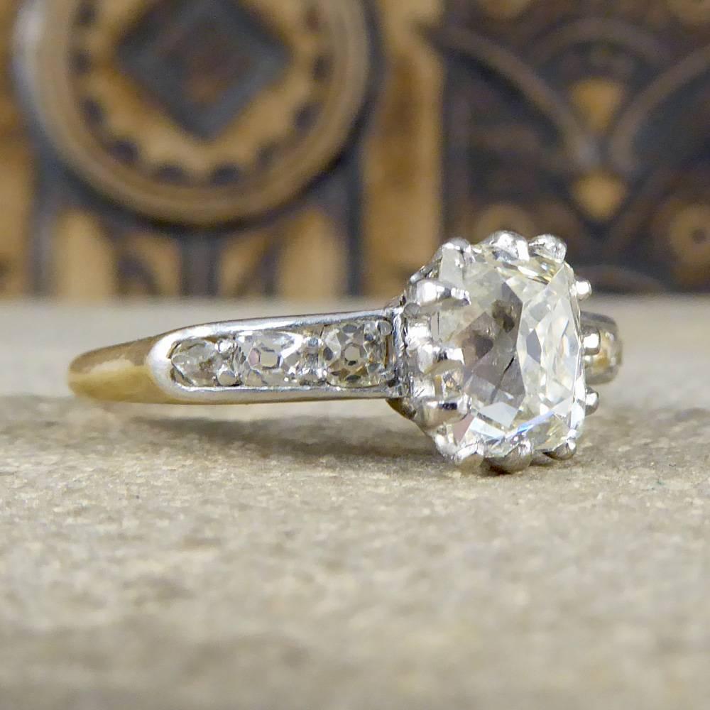 This lovely antique Diamond ring was hand crafted in the Late Victorian ear showing how styles and fashion may change but there is always room for a classic Diamond Solitaire with shoulders. The centre stone weighs 1.55ct with a total of 1.80ct