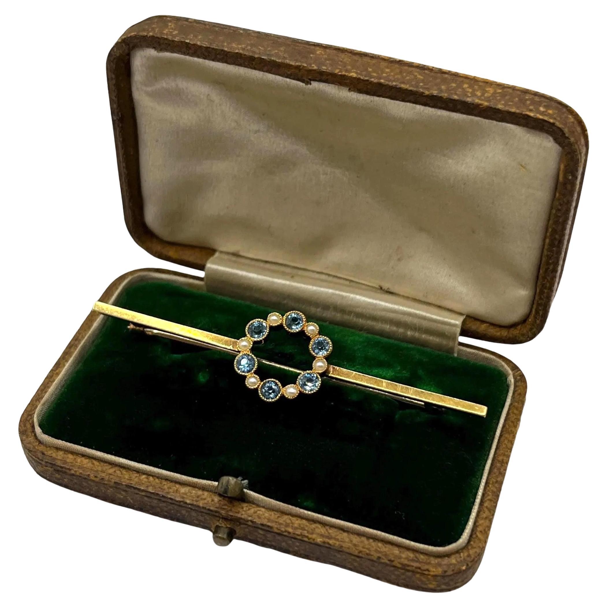 Broche ancienne en or 15ct de l
époque édouardienne avec aigue-marine et perles