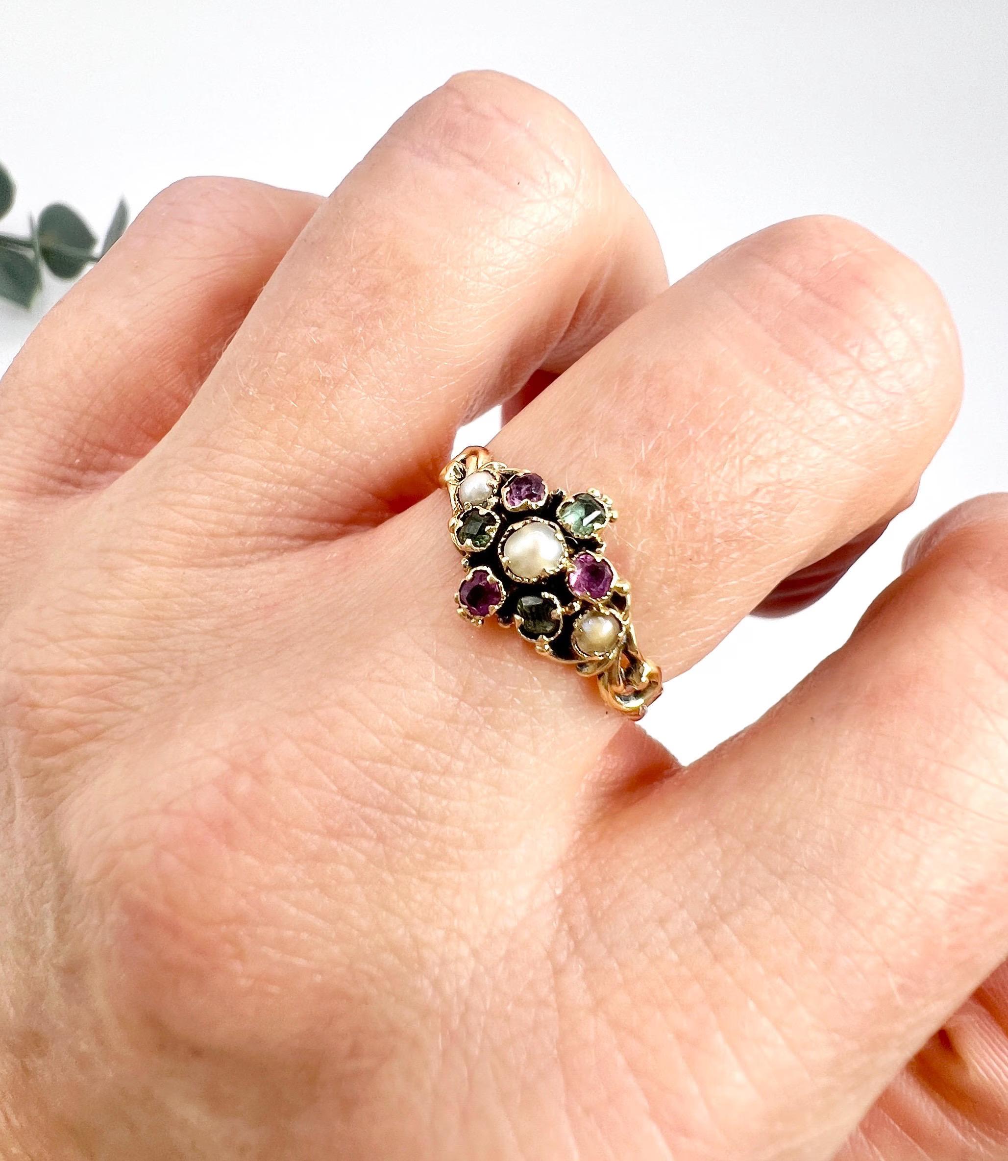 Antique Suffragette Ring 

15ct Yellow Gold Tested

Circa 1880

This stunning Suffragette ring is crafted from 15ct yellow gold and features a beautiful combination of Amethyst, Emerald and Seed Pearl gemstones in a daisy formation. The ring