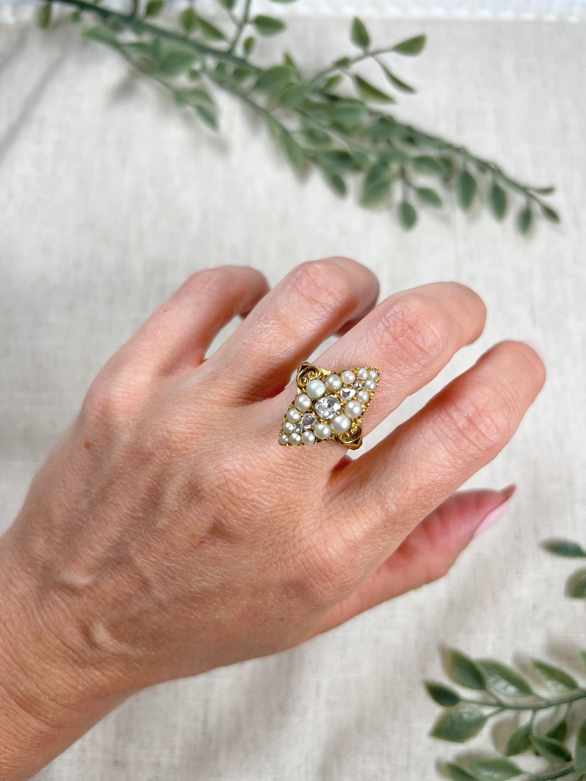 Antique Marquise Ring 

15ct Gold Tested

Circa 1860

Fabulous, 15ct yellow gold, early Victorian marquise/navette shaped ring. Set with five beautiful, old cut diamonds down the centre. Surrounded by a border of pretty, natural seed pearls &