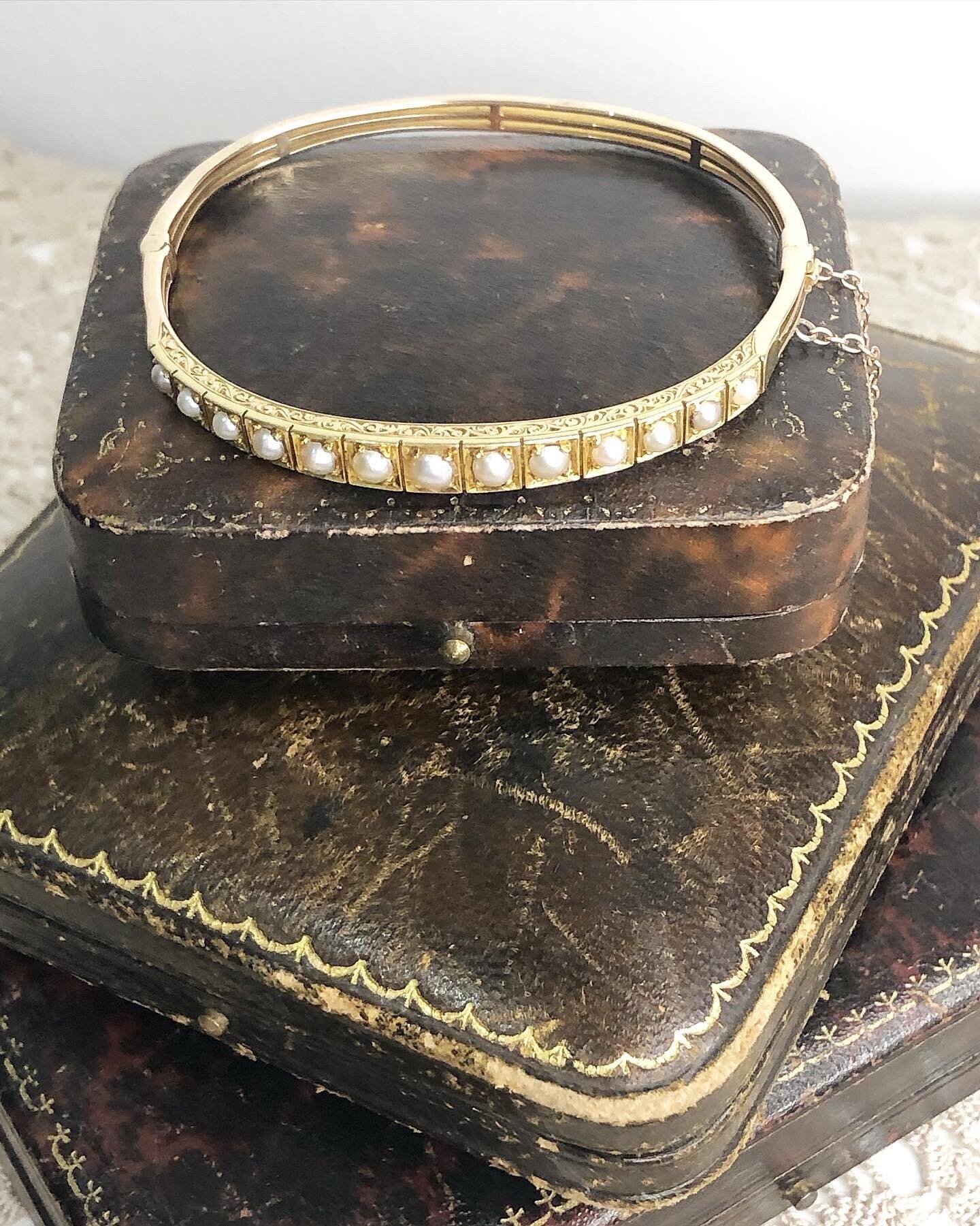 Victorian Gold Bangle 

15ct Gold with Beautiful Seed Pearls 

(15ct stamped on the clasp tongue)

Victorian 1880

Gorgeous Hand Carved Detail

Secure clasp with safety chain

Free International Shipping

All of our items are either Antique, Vintage