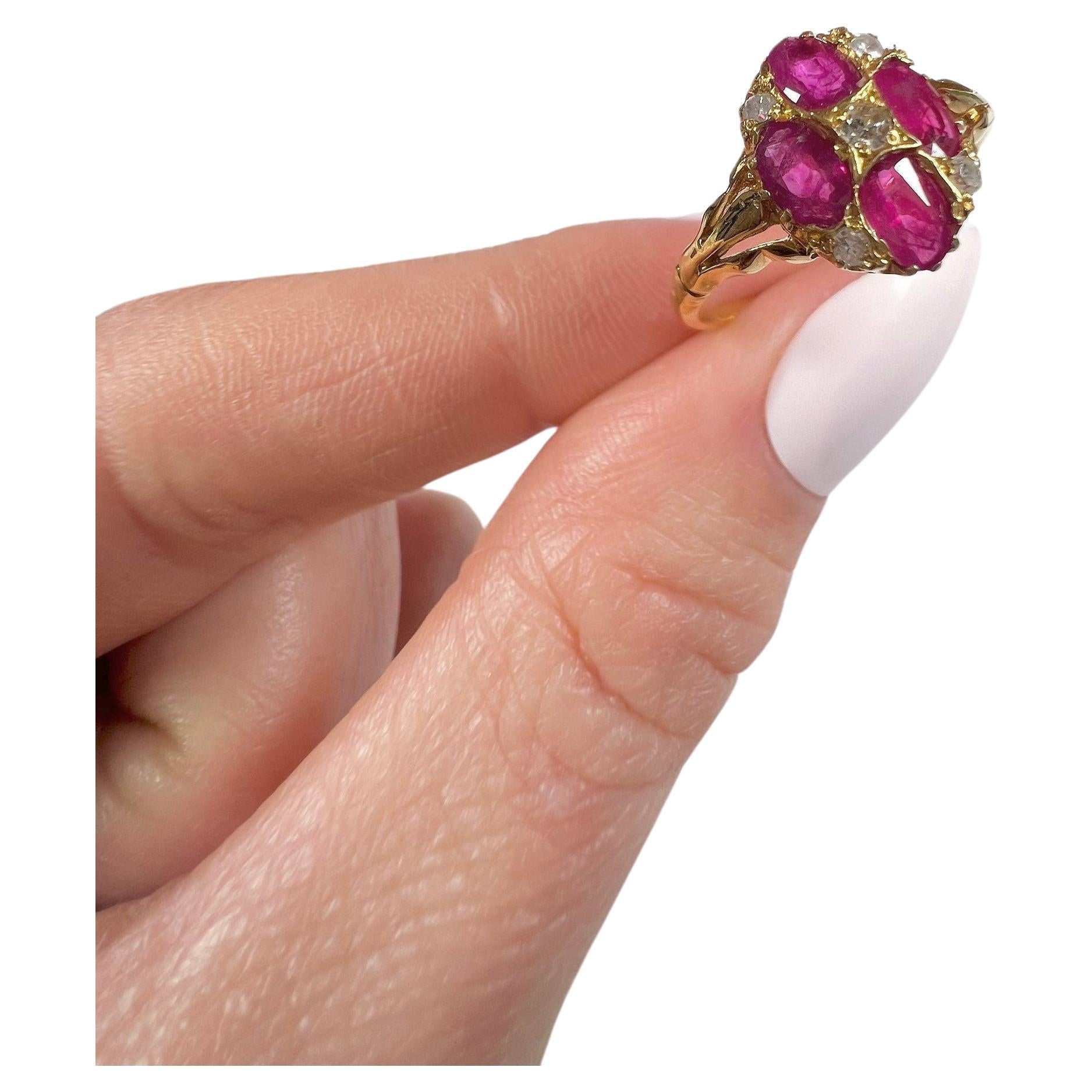 Antique Ruby & Diamond Ring 

15ct Gold Stamped 

Circa 1880

Fabulous, Oval Shaped Victorian Ring. Set with Four Oval Shaped Rubies & Five Diamonds. Mounted on a 15ct Gold Band with Pretty, Split Shoulders. 

Face Of The Ring Measures Approx Height