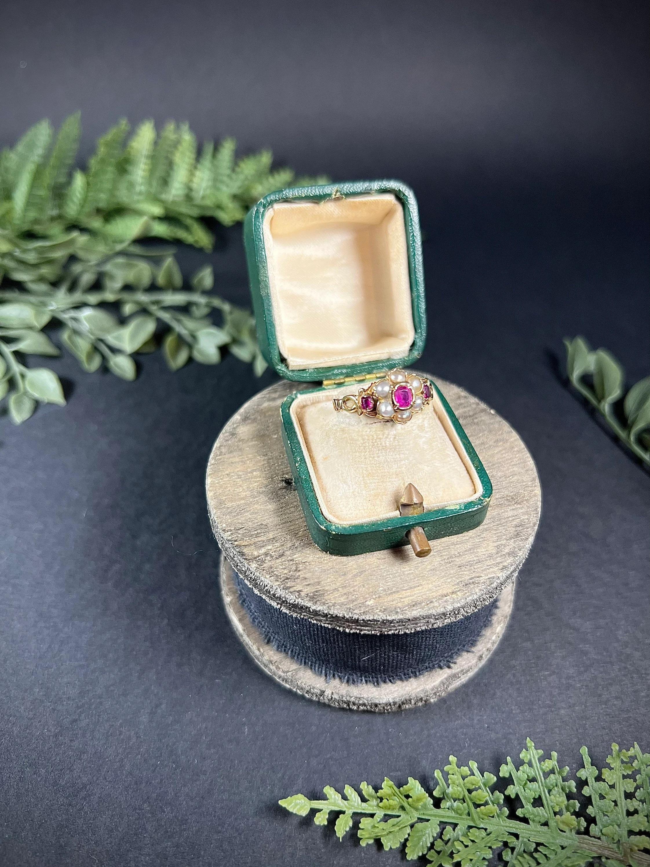 Antique Daisy Cluster Ring

15ct Gold Tested 

Circa 1880

Pretty, Victorian cluster ring. Set with an oval, faceted, natural ruby centre & a cluster of natural, milky seed pearls making a beautiful daisy formation. 
The ring features fabulous gold
