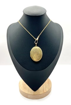 Médaillon ovale ancien en or jaune 15ct, gravure florale du début de l'époque victorienne