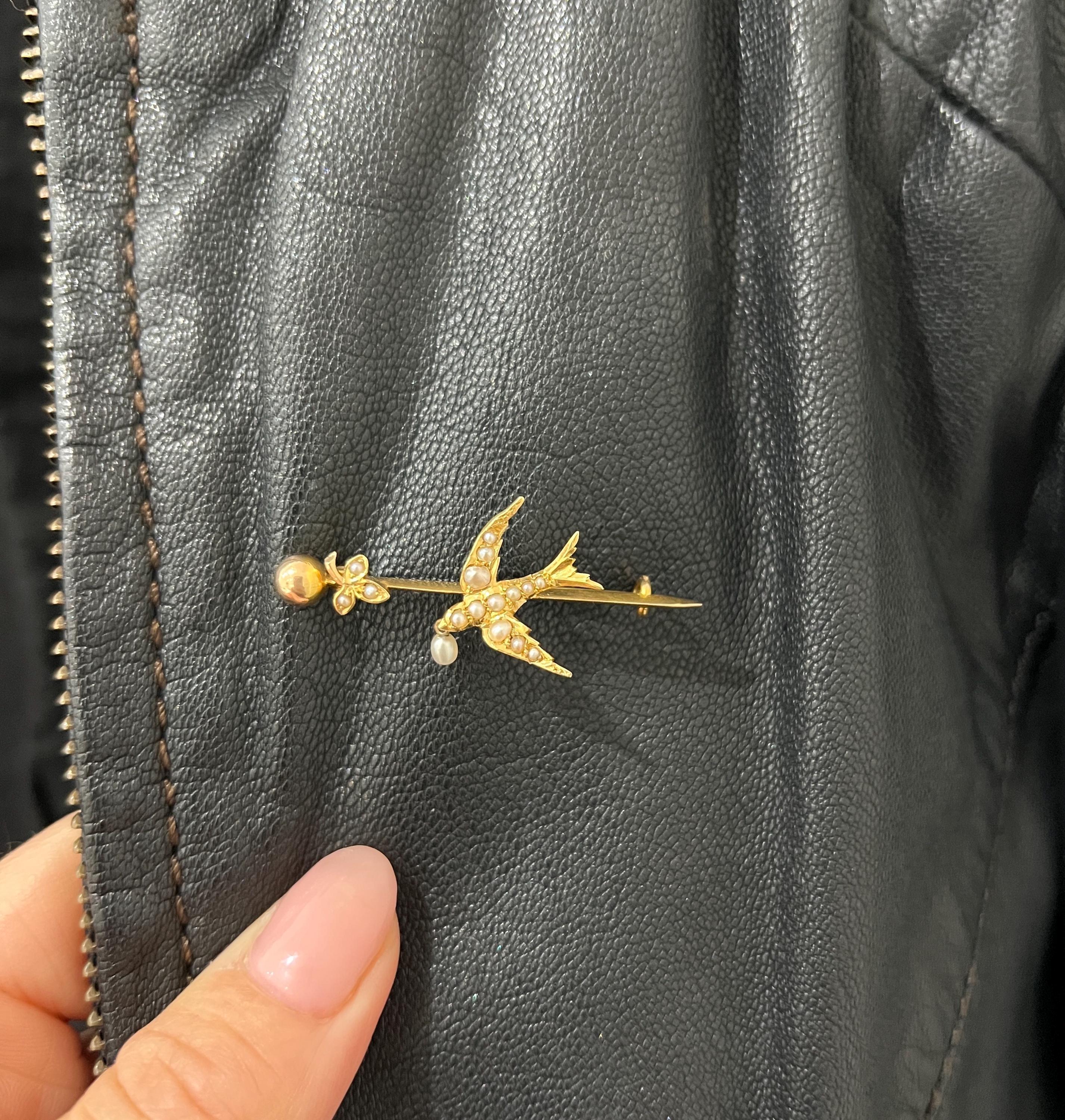 Antique Swallow Brooch

15ct Yellow Gold Tested

Circa 1910

This exquisite brooch, crafted from 15ct yellow gold, showcases the elegance of the Edwardian era. Beautifully decorated with delicate natural seed pearls, the swallow design captures a