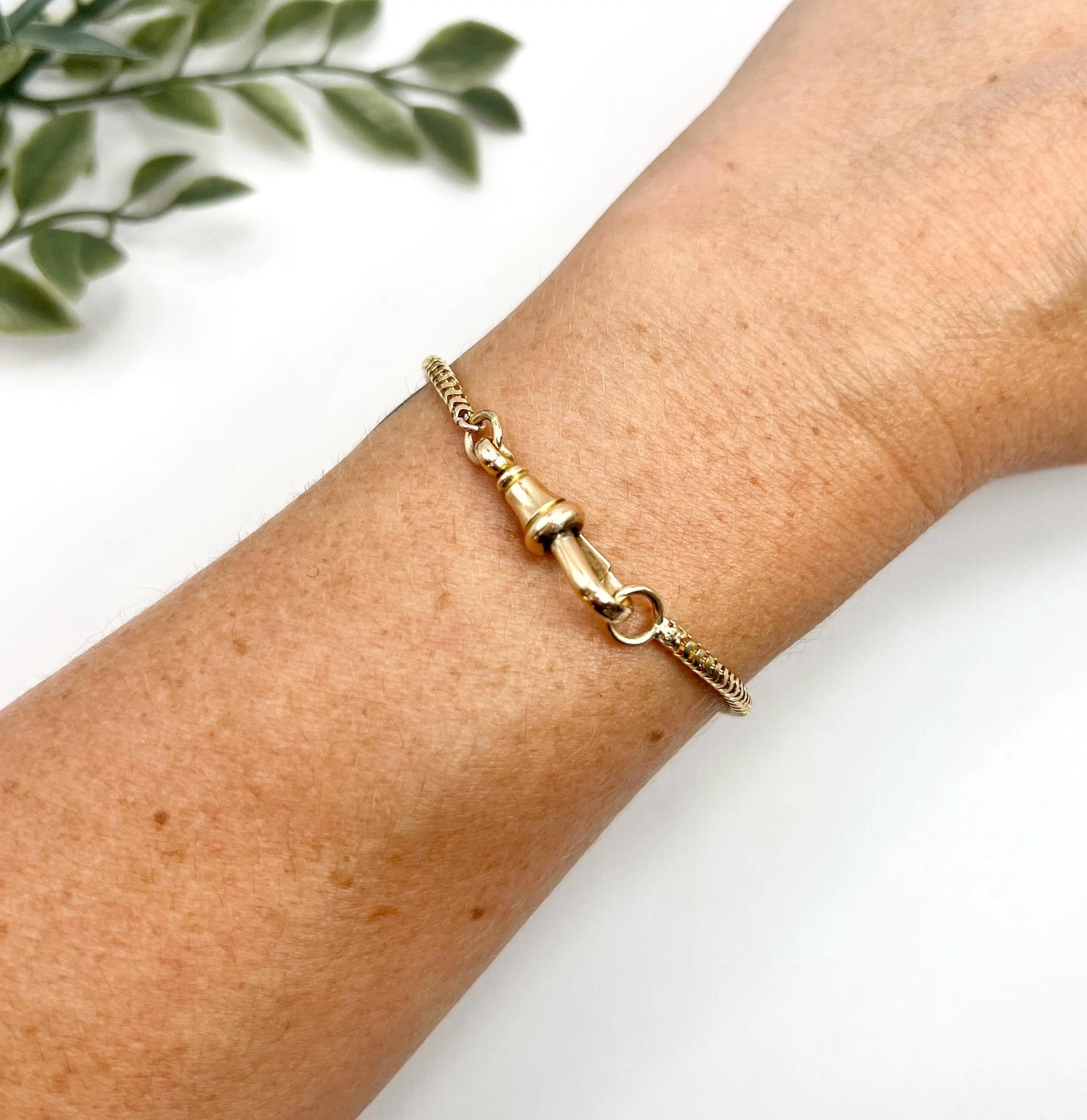 Antique Snake Bracelet 

15ct Gold Stamped

Circa 1890

This exquisite bracelet showcases stunning craftsmanship in 15ct yellow gold, featuring a unique snake link design that elegantly twists and turns. Secured with a reliable swivel clip
