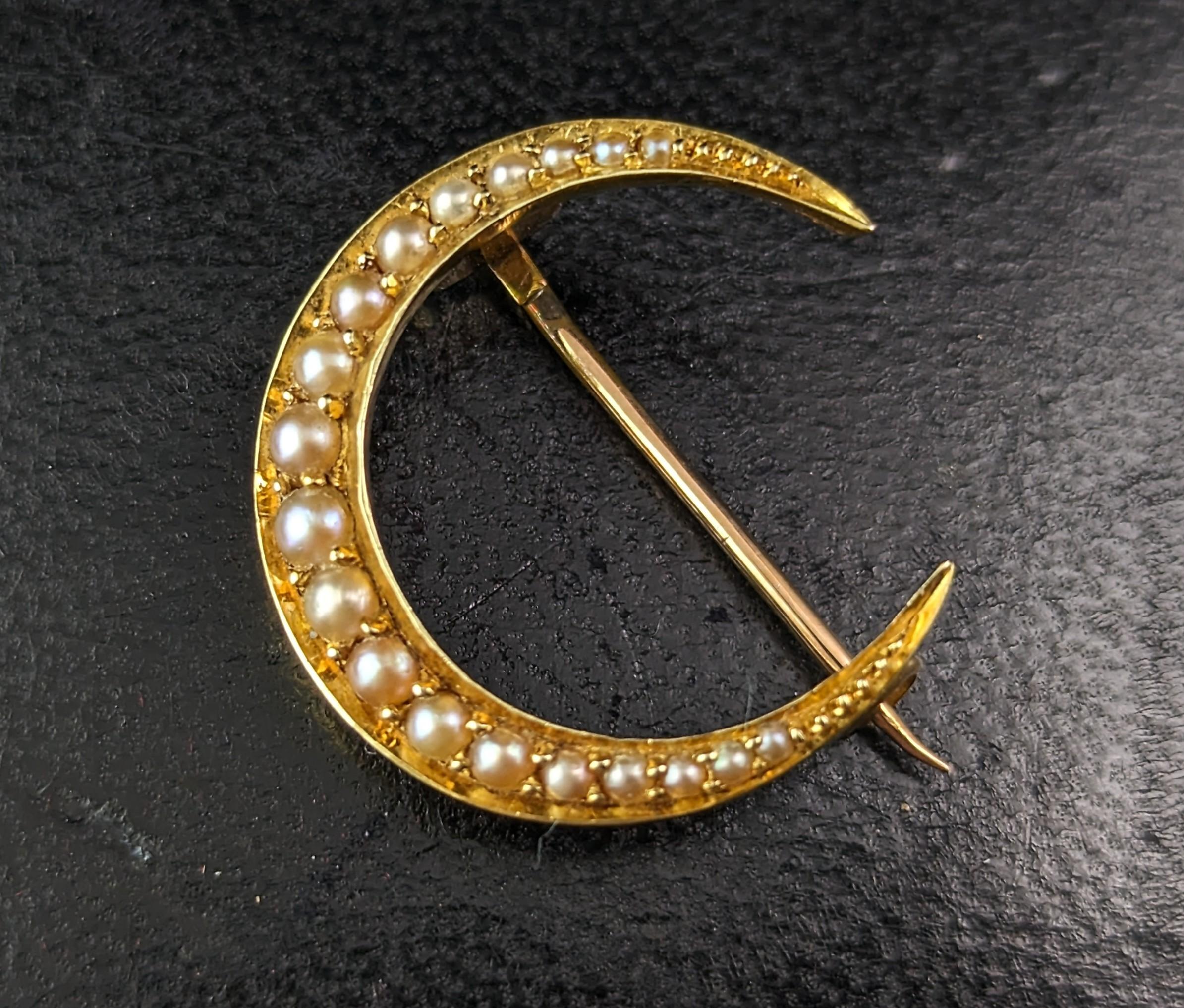 A gorgeous antique, late Victorian, 15ct gold and pearl crescent brooch.

A beautiful closed crescent in very rich bloomed 15ct yellow gold, it is set with creamy pearls that graduate from the ends to centre.

Crescent moons were a popular motif in