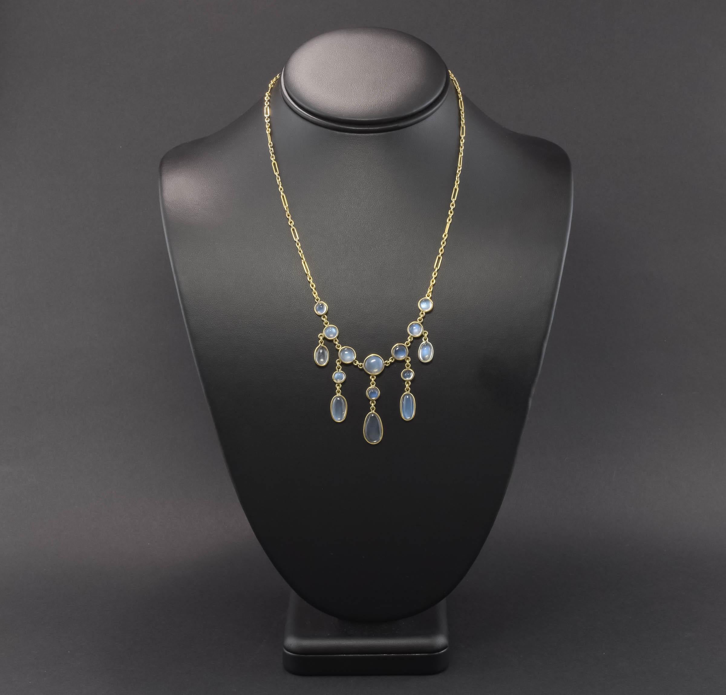 Offered is a graceful late Victorian to early Edwardian period Moonstone Drop or Fringe Necklace.  Fifteen round and oval cabochon cut Moonstones are suspended from a beautiful 15K gold fancy link chain, for an estimated total carat weight of 15.09