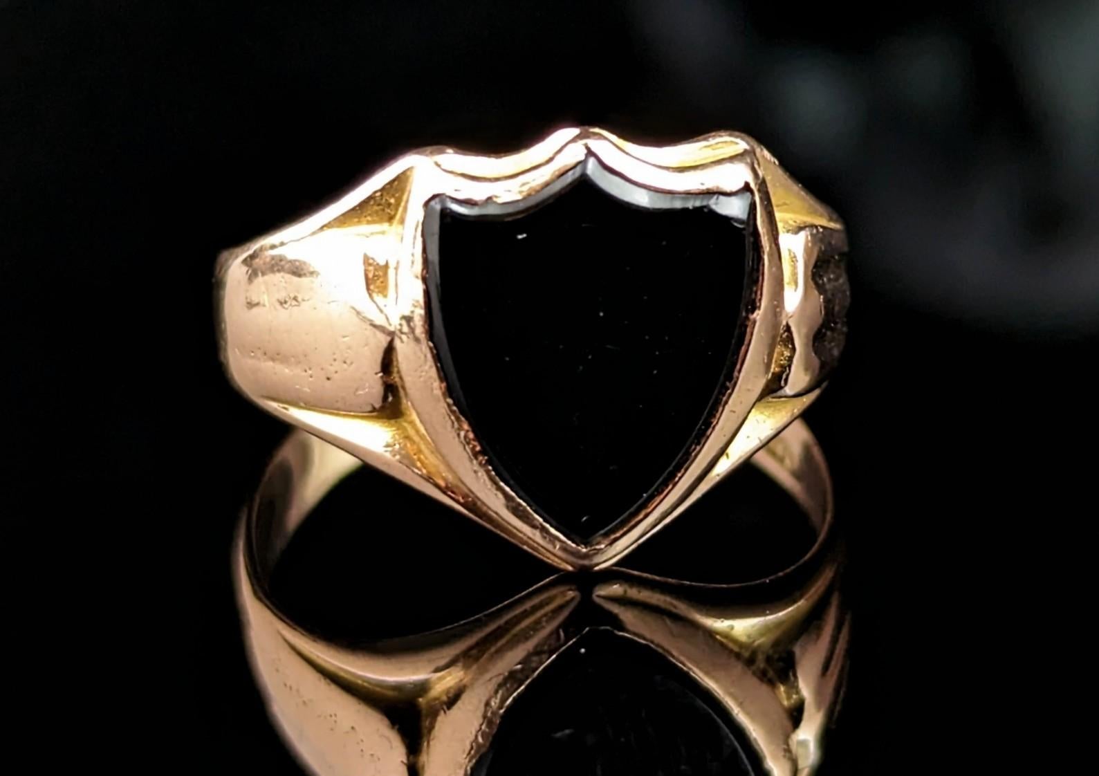 This handsome antique, Victorian era
15kt gold and Black onyx signet ring has everything you could wish for in a signet ring!

It has a shield shaped face set with an inky black Onyx stone, the moody tone complementing the warm rosey gold perfectly,