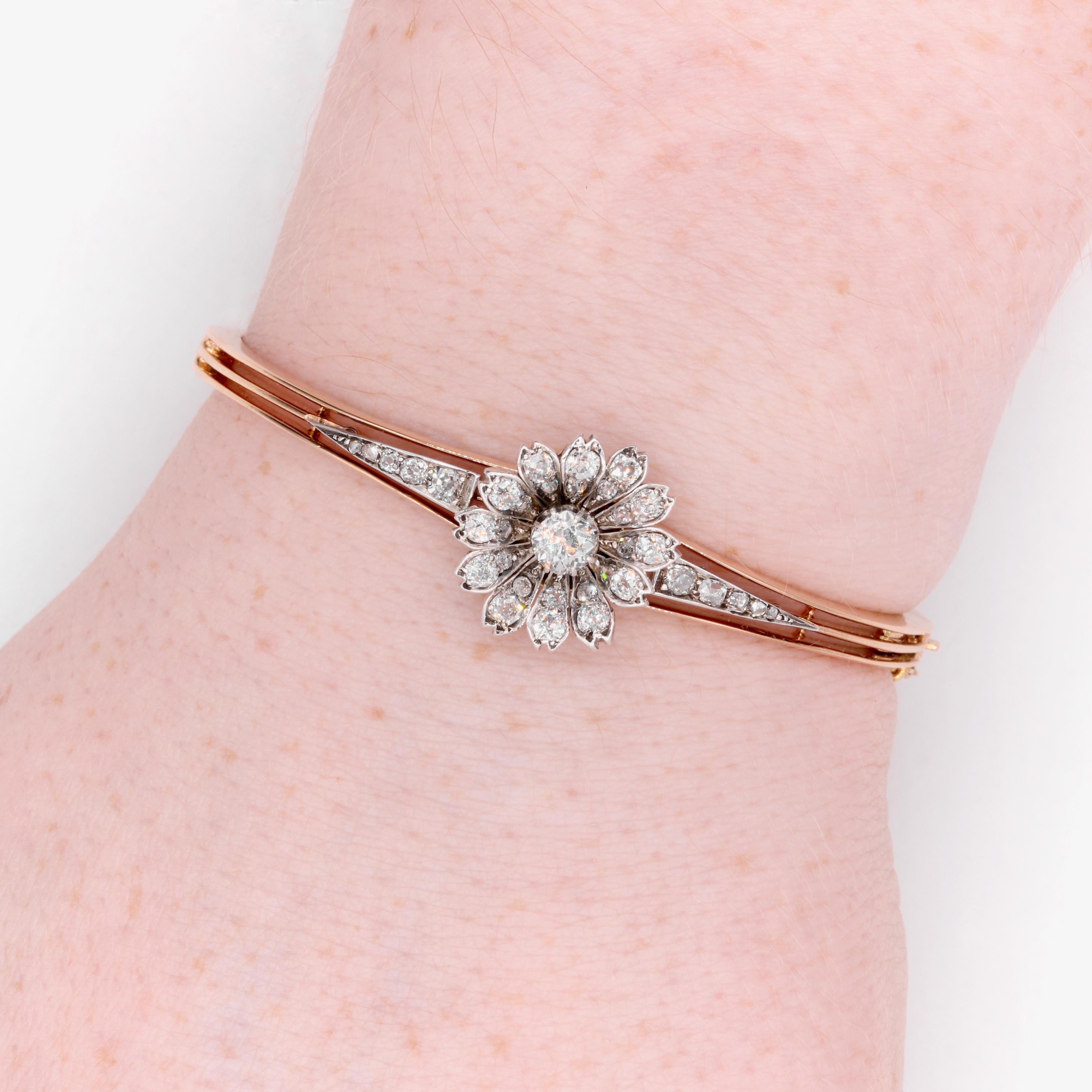 A Victorian diamond, silver, and yellow gold bangle, comprising old large old mine cut diamond, thirty smaller old cut diamonds, and four rose cut diamonds, set in silver and 15 karat yellow gold. 

My favourite thing about this Victorian Yellow