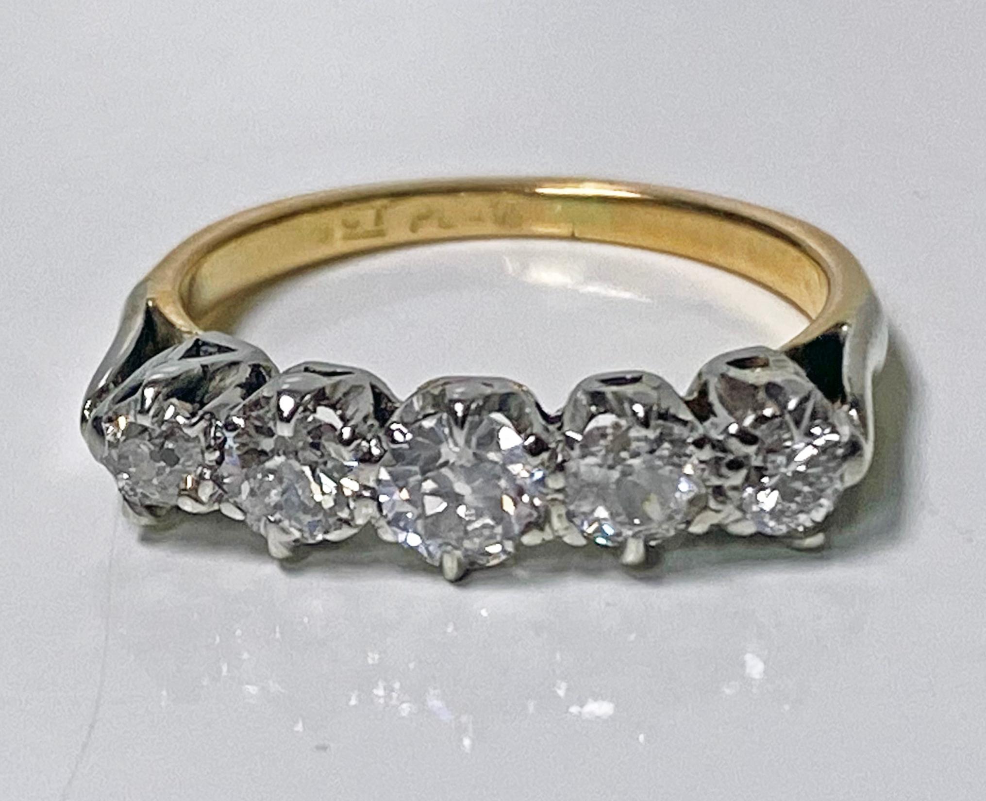 Antique 15K and Platinum (top) Diamond Ring, C.1920. The five stone diamond Ring set with old european cut diamonds average I1 clarity, average J color, plain basket setting and shank. Centre stone approximately 0.25 ct. Total Item Weight: