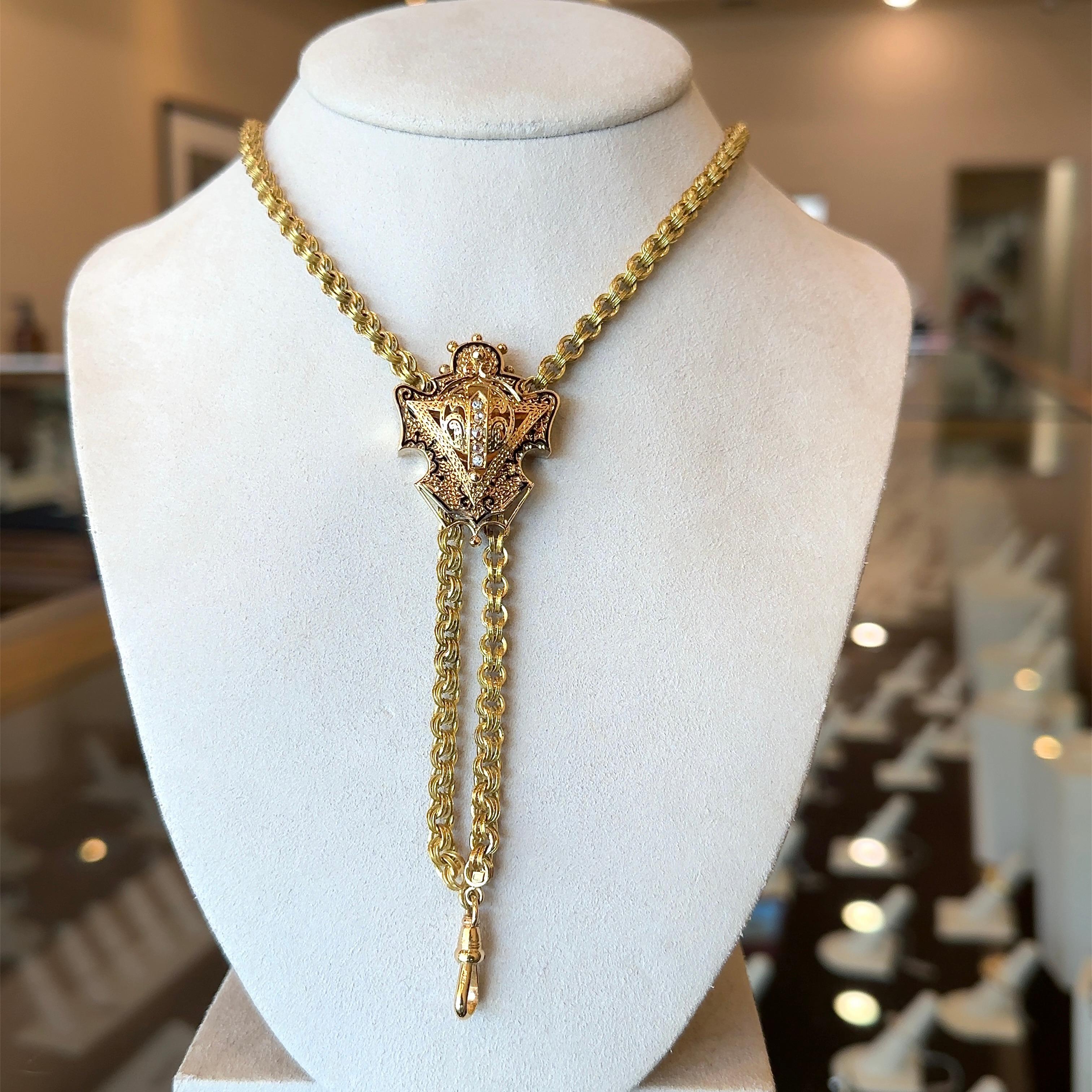 This antique chain dates from the early-1900s. The chain is 15K yellow gold, that can appear as green-gold in color depending on the lighting. The double rolo chain links measure approximately 4.3mm wide. The full length of the chain measures