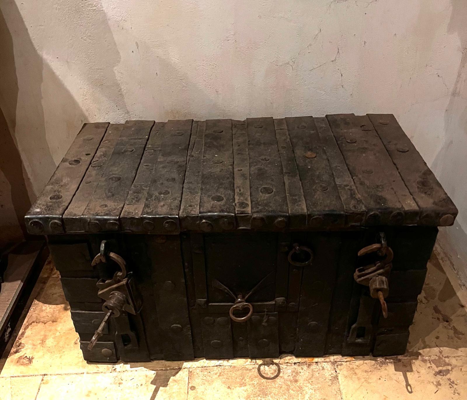An exceptionally rare and important 15th century Gothic iron strongbox, weighing approximately 80 kg. This large strongbox retains its original mechanical locking system, which remains in perfect working order- a remarkable survival from the