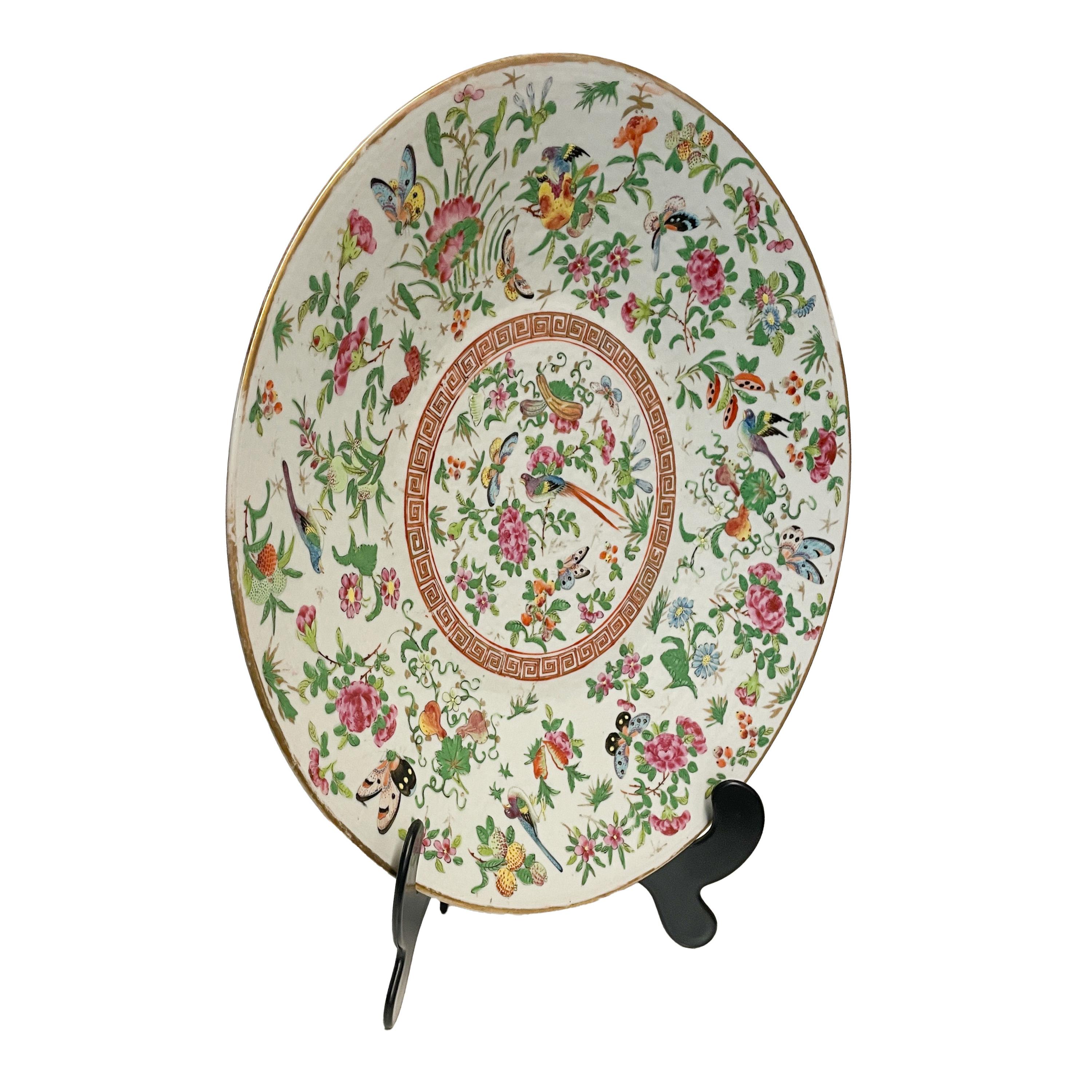 A fine & large antique 19th century Chinese Canton Qing dynasty Porcelain charger, circa 1880.
The charger is very finely hand painted, to the center is a circular panel with polychrome birds & butterflies surrounded by a circular gilded Greek key