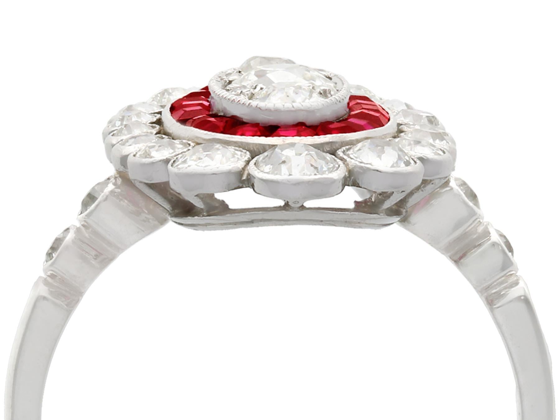 A stunning antique 1.60 carat diamond and 0.60 carat ruby, platinum cluster style cocktail ring; part of our diverse antique jewelry and estate jewelry collections.

This stunning, fine and impressive diamond and ruby ring has been crafted in