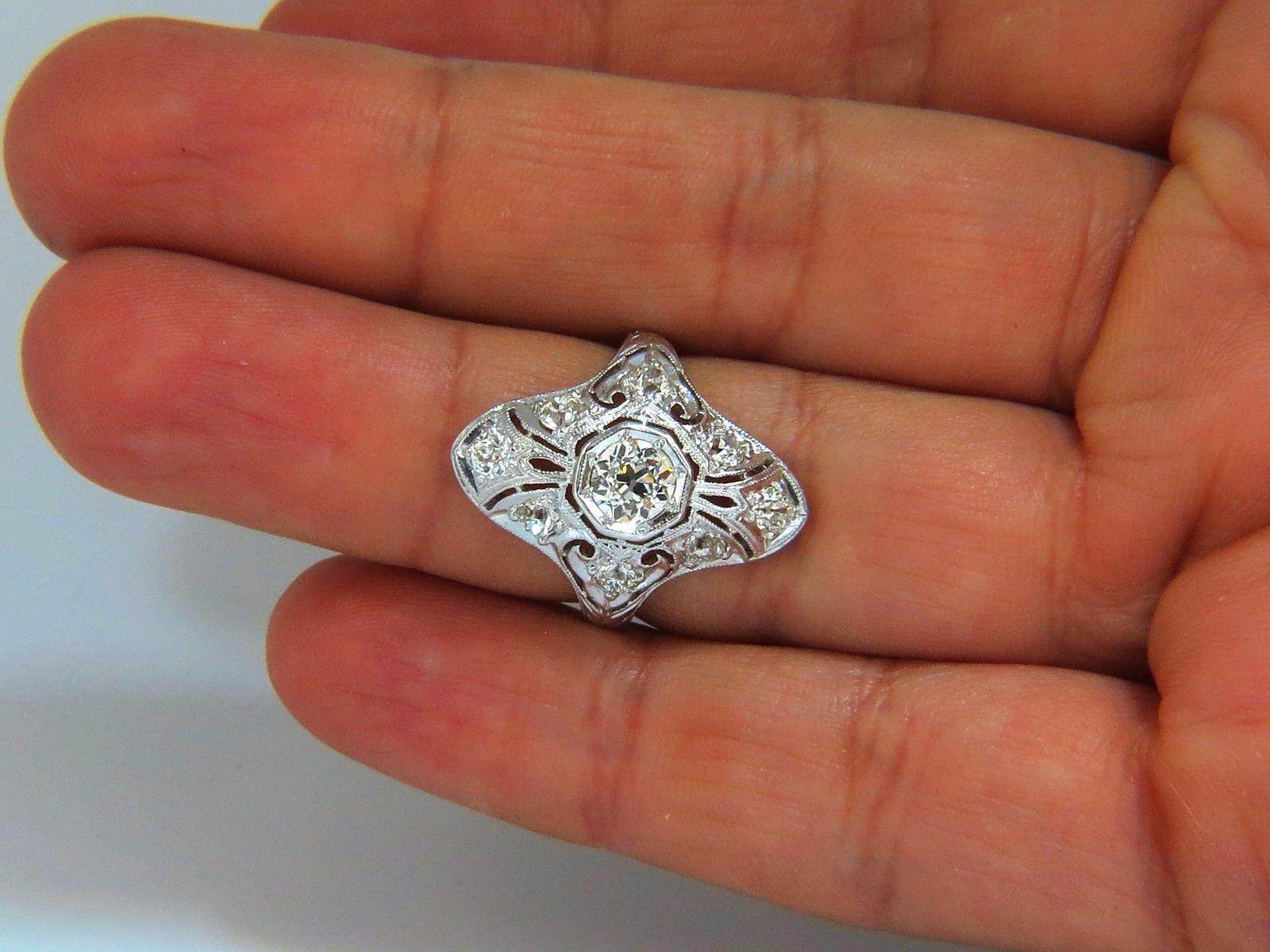 Restored Victorian Diamond Ring.

.75ct. Natural round center diamond (Old mine cut)

I color VS-2 clarity

 5.5mm diameter 

Side round diamonds: 

 .87ct 

I-color vs-2 clarity.

Platinum

Ring size: 6.5

Please inquire about sizing prior to