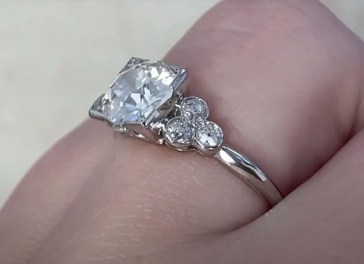 A breathtaking example of Art Deco craftsmanship, this exquisite platinum ring showcases a dazzling old European cut diamond, securely set in delicate box prongs. Weighing approximately 1.60-carats, the center diamond radiates timeless brilliance,