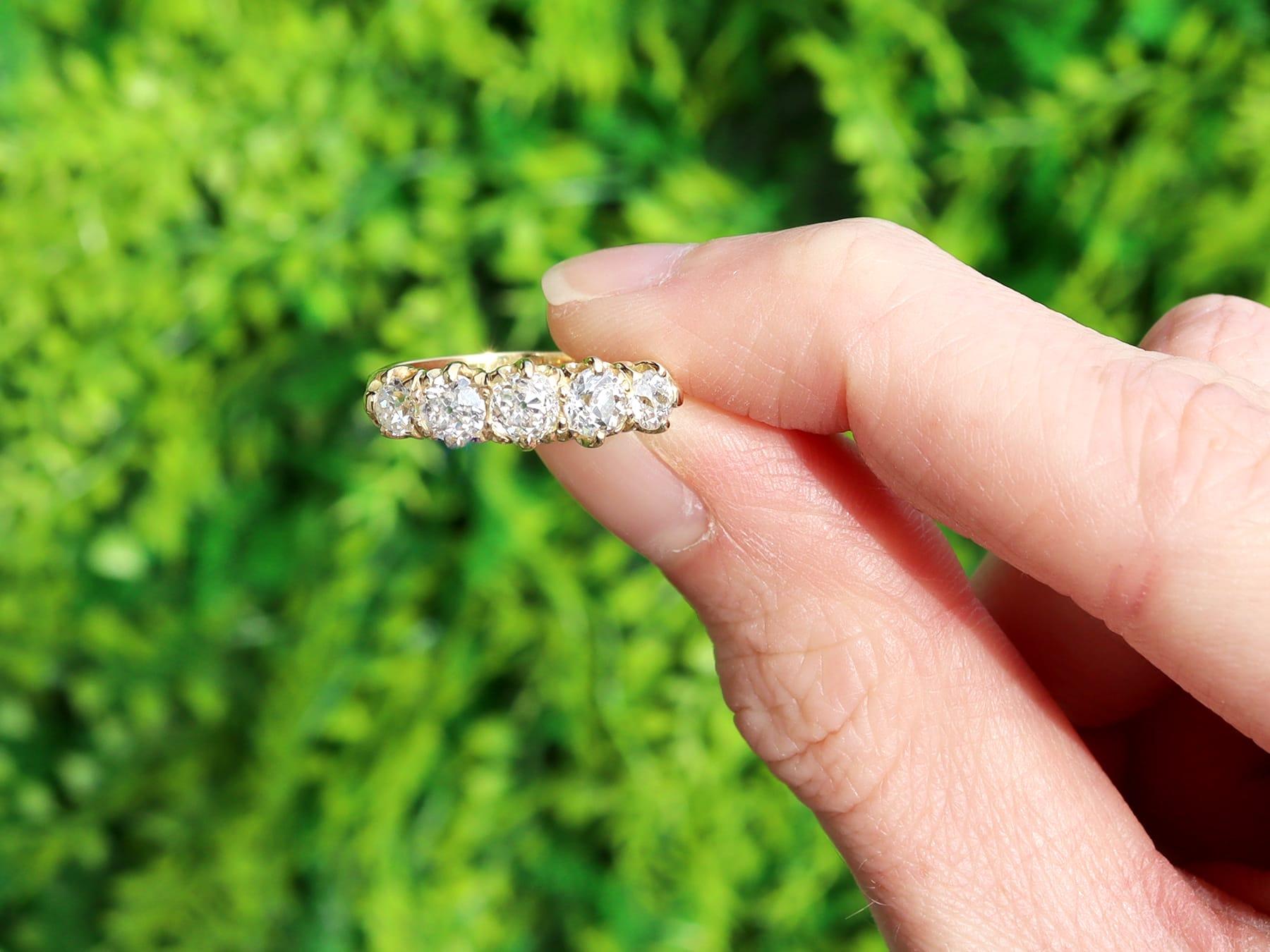 A fine and impressive antique Edwardian 1.67 carat diamond and 18 karat yellow gold five stone ring; part of our diverse antique diamond rings and estate jewelry collections.

This fine and impressive antique five stone ring has been crafted in 18k