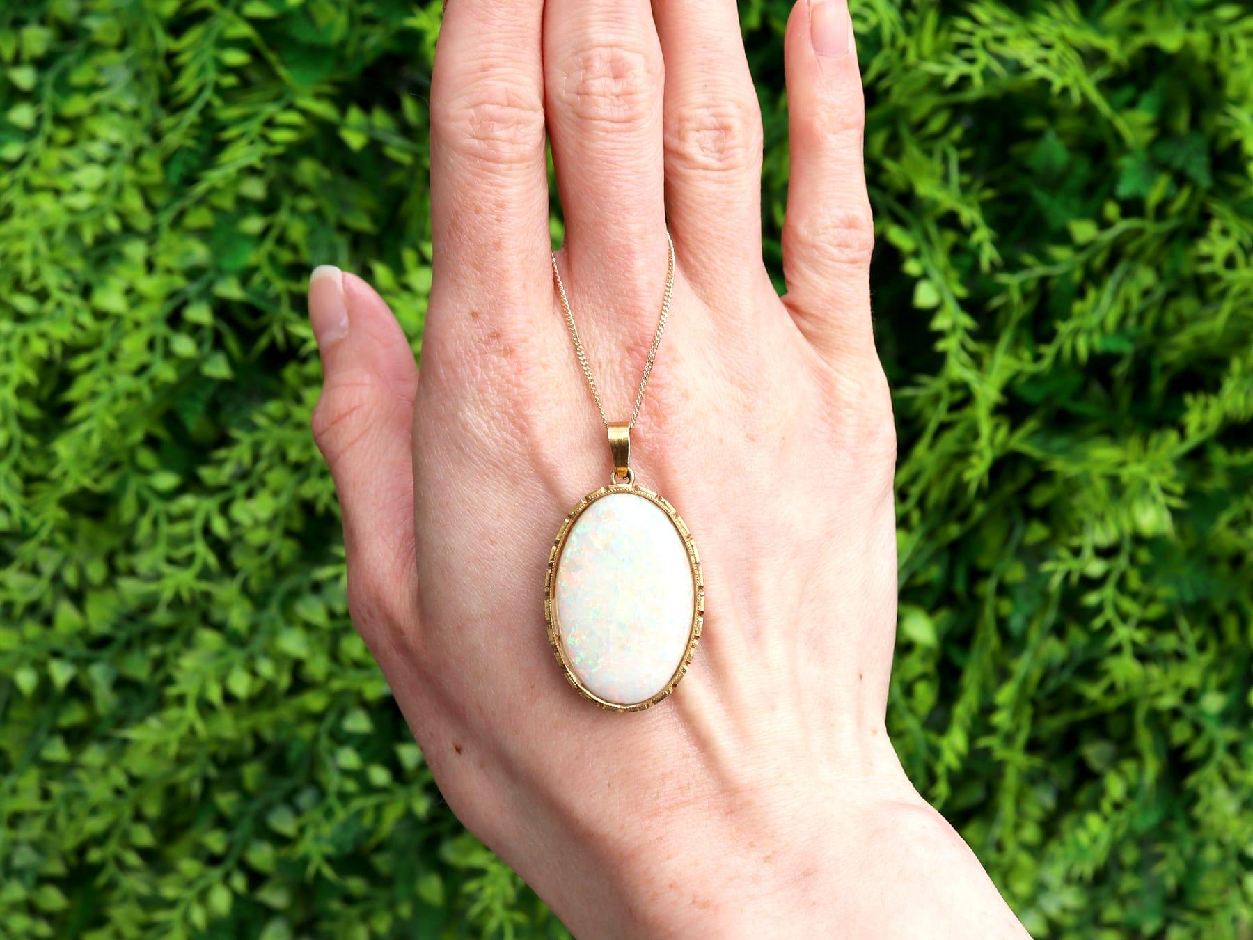 A fine and impressive antique 16.80 carat opal and 18 karat yellow gold pendant; part of our diverse antique opal jewellery collections.

This fine and impressive antique Edwardian pendant has been crafted in 18k yellow gold.

The impressive pendant