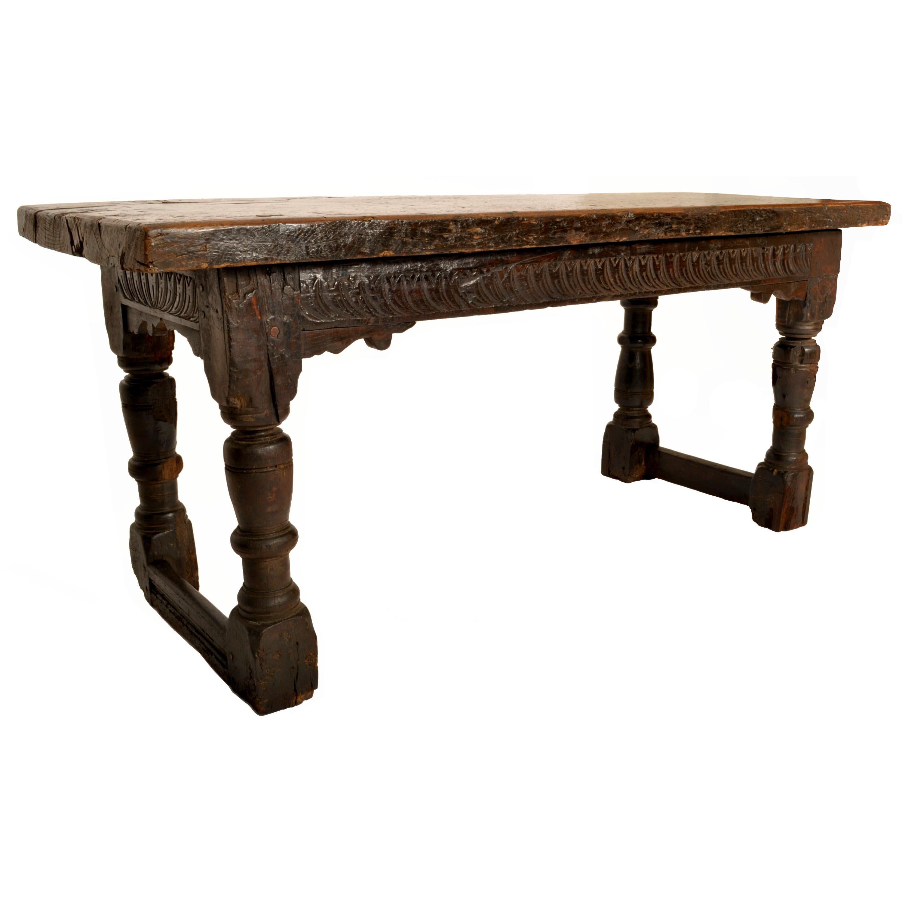 A very rare and original antique 500+ year old carved Tudor refectory/serving table, circa 1550.
The table dating from the reign of Henry VIII and having a very substantial plank top (over 2.5