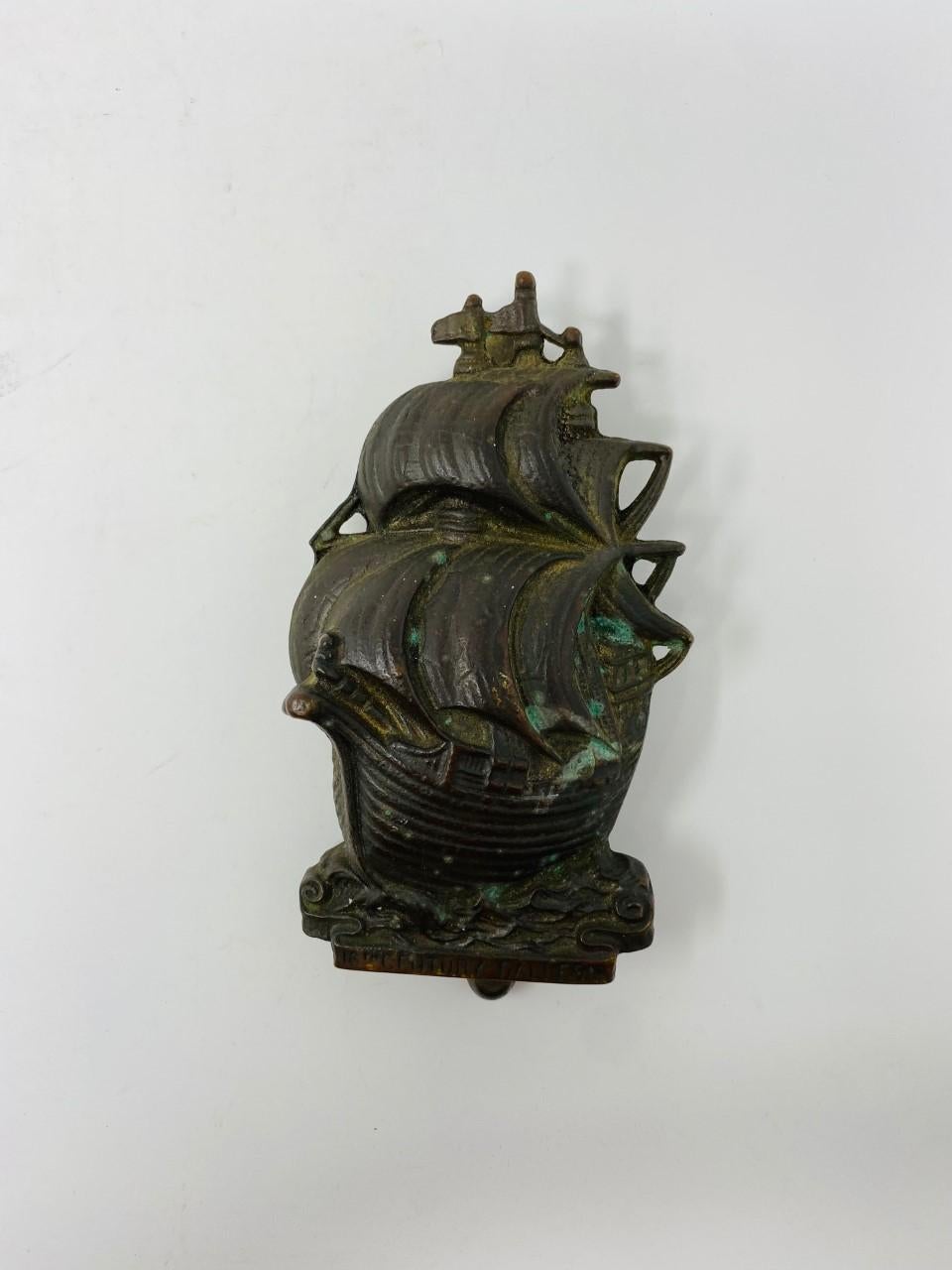 Heavy vintage solid brass 16th century Gallion design door knocker. Antique piece from the 1920s. This piece is 7 inches tall, 4 inches wide. It attaches to desired surface with 2 screws (included, original screws). Distance between screws is 5