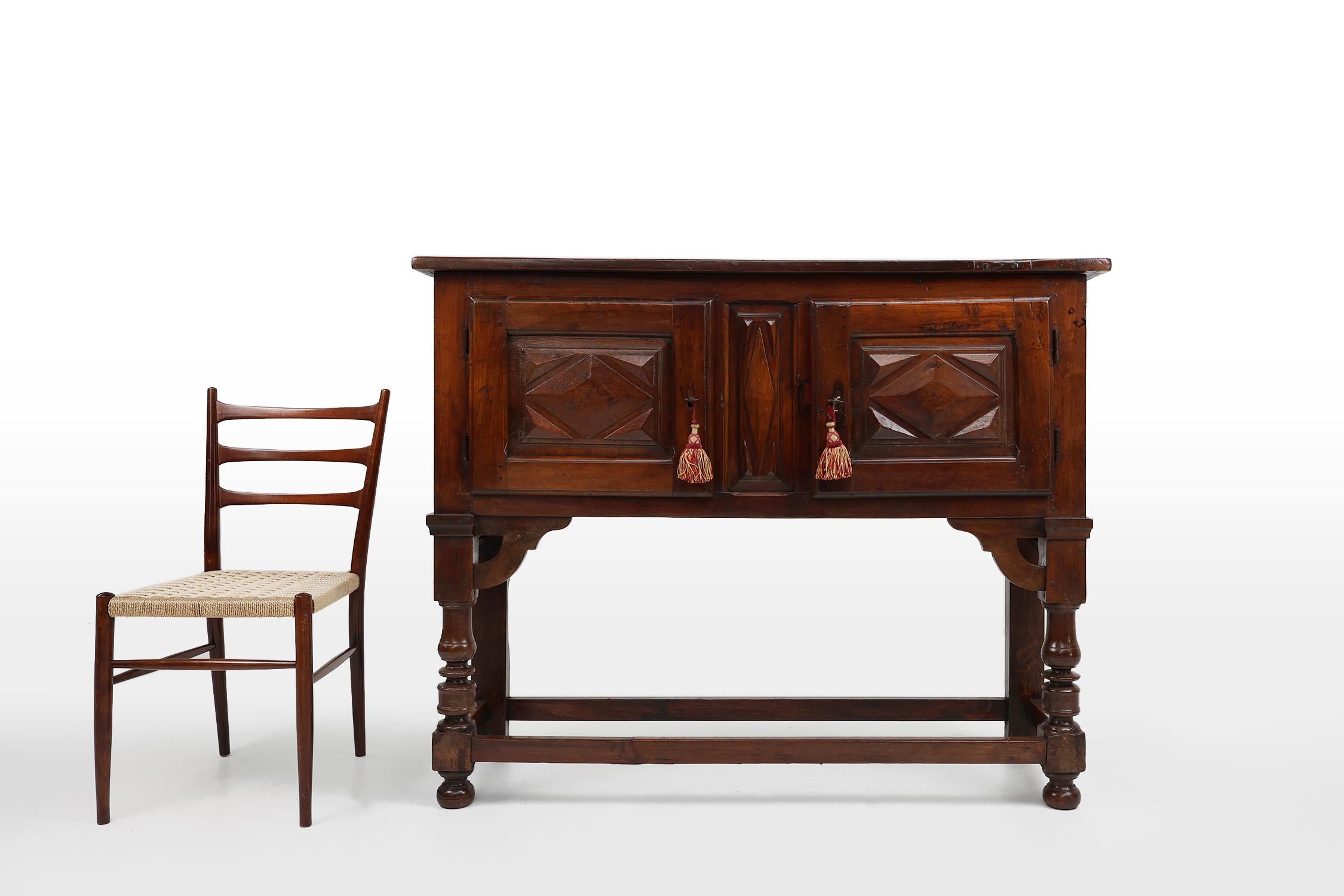 Spain / 16th century / cabinet / oak / Rustic / Antique 

A stunning Spanish antique highboard or cabinet in warm oak wood with two doors from the 16th century. The cabinet has its original keys and offers ample storage space behind the