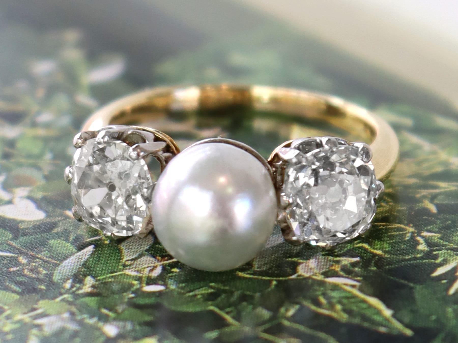 A stunning, fine and impressive 1.70 carat diamond and natural saltwater pearl, 18 karat yellow gold and platinum trilogy ring; part of our diverse antique jewellery and estate jewelry collections.

This stunning, fine and impressive antique trilogy